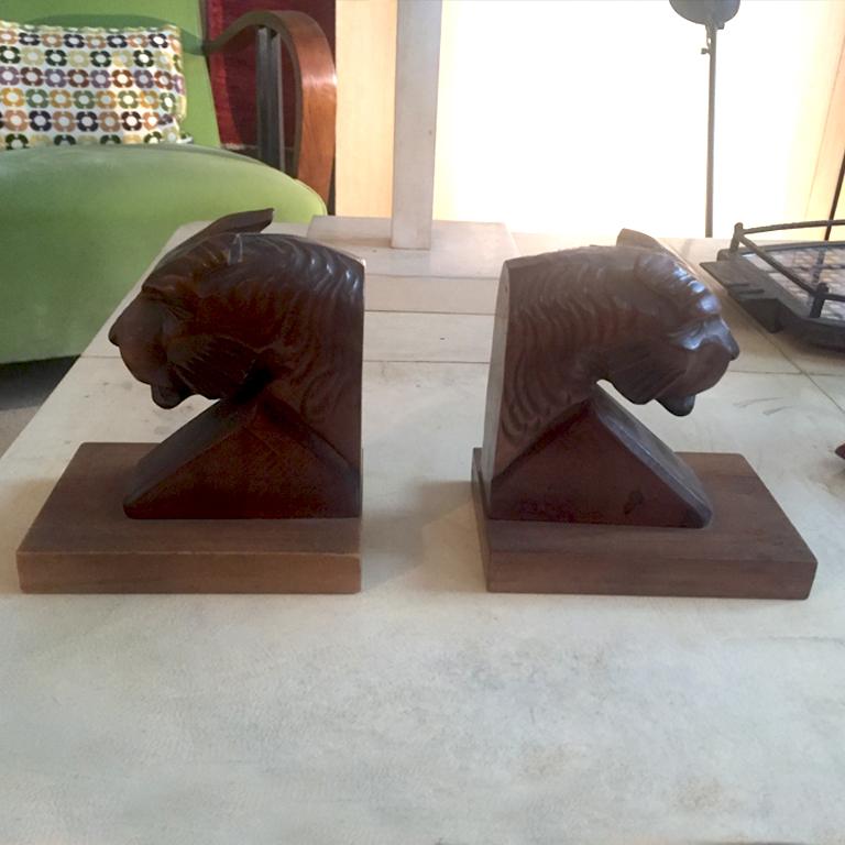 Amazing original and rare book holders in wood showing a panther head, 1930s.