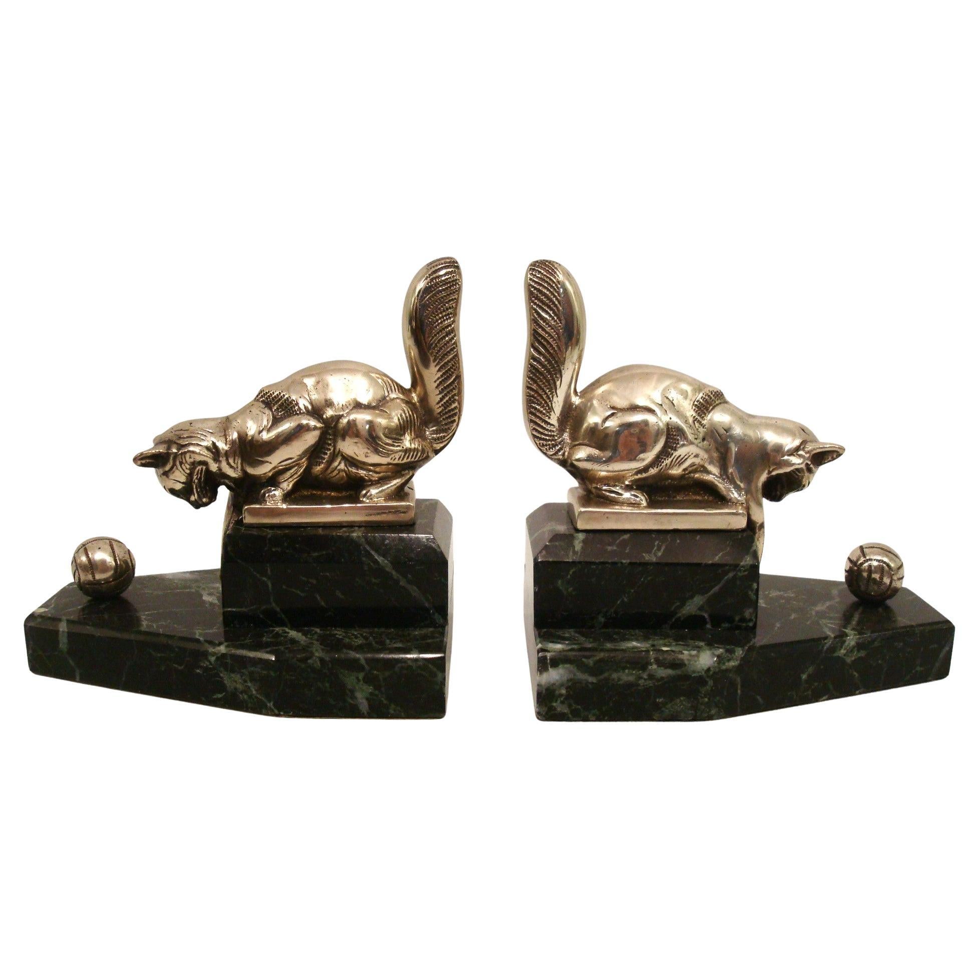 Pair of art deco bookends Cat playing with a Ball. France 1925 For Sale