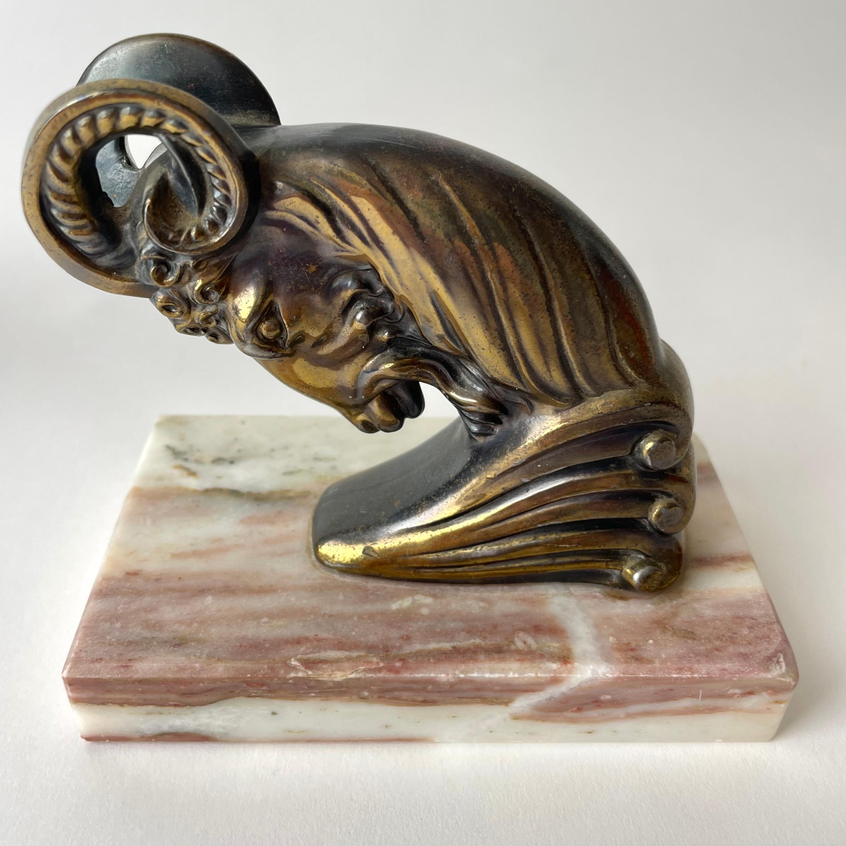 Metal Pair of Art Deco Bookends from the 1930s with very period and powerful rams. For Sale