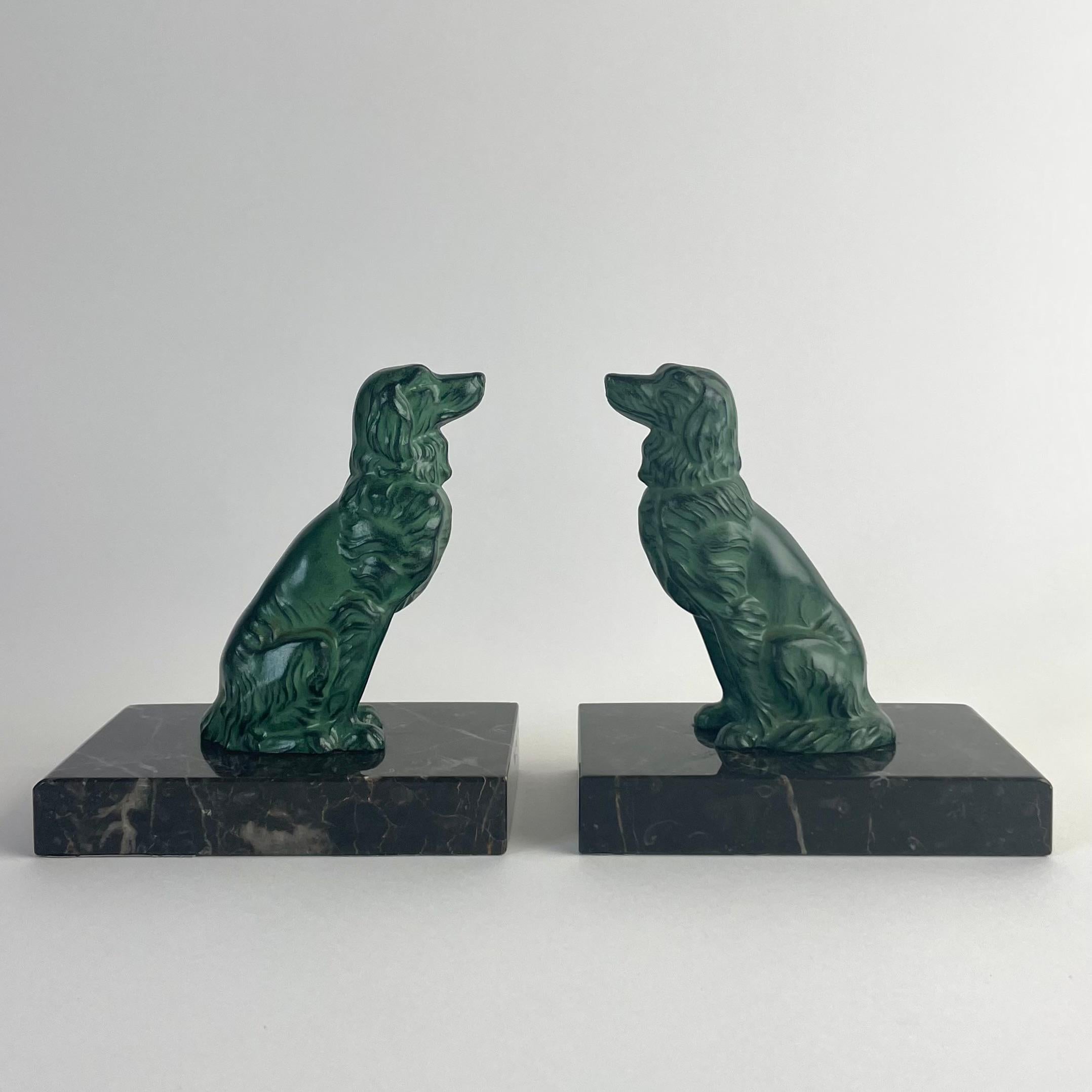 
Pair of Art Deco Bookends in Spelter and Marble, Golden Retriever Motif, 1930s

Charming pair of Art Deco bookends from the 1930s, crafted in patinated spelter with finely modelled figures of Golden Retrievers. Each dog is seated proudly on a base