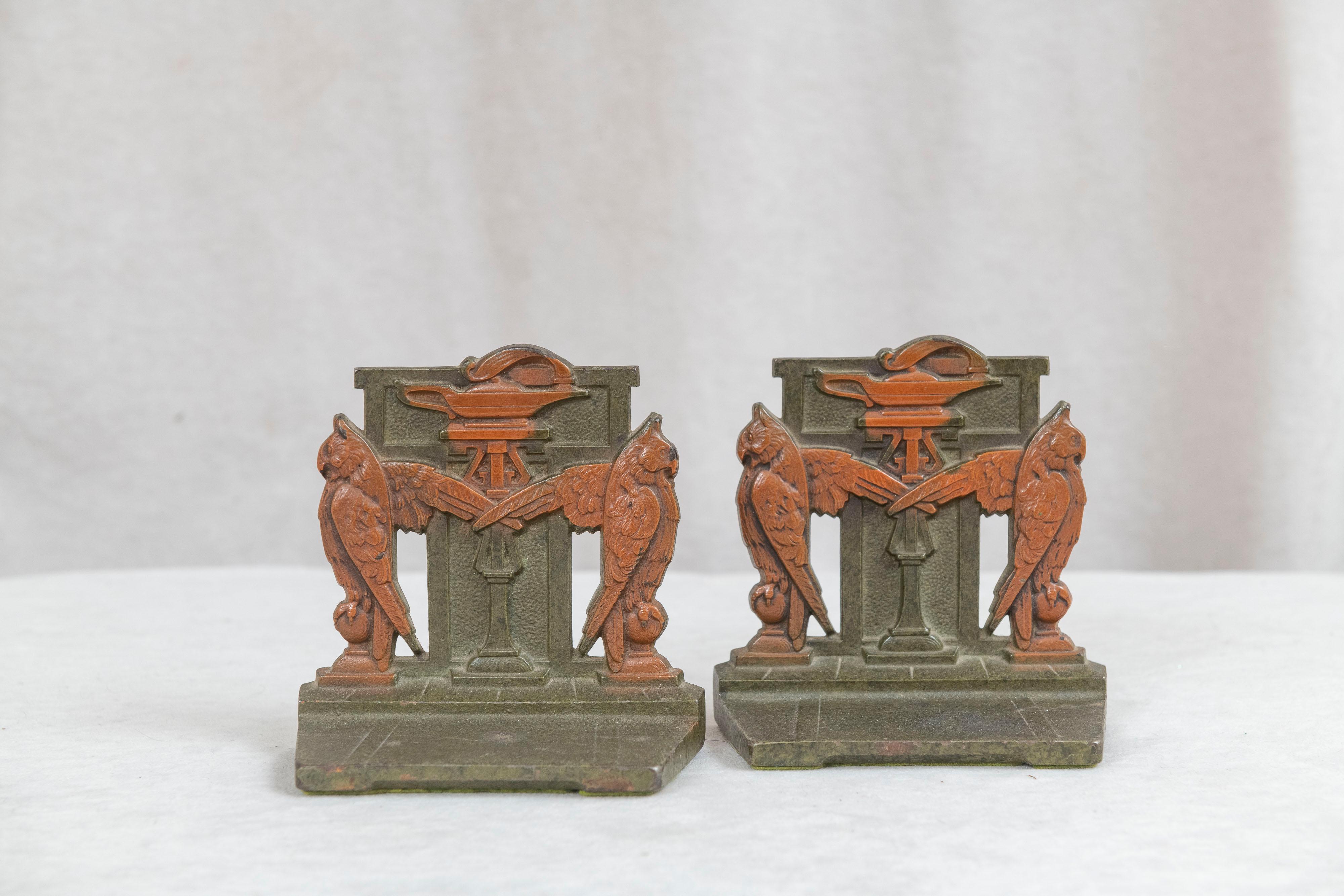These bookends were made by the premier bookend company, Judd. They have that rich green and brown factory painted finish, and are finely cast as we have come to expect from this company. The art deco design with a pair of owls flanking a lamp with