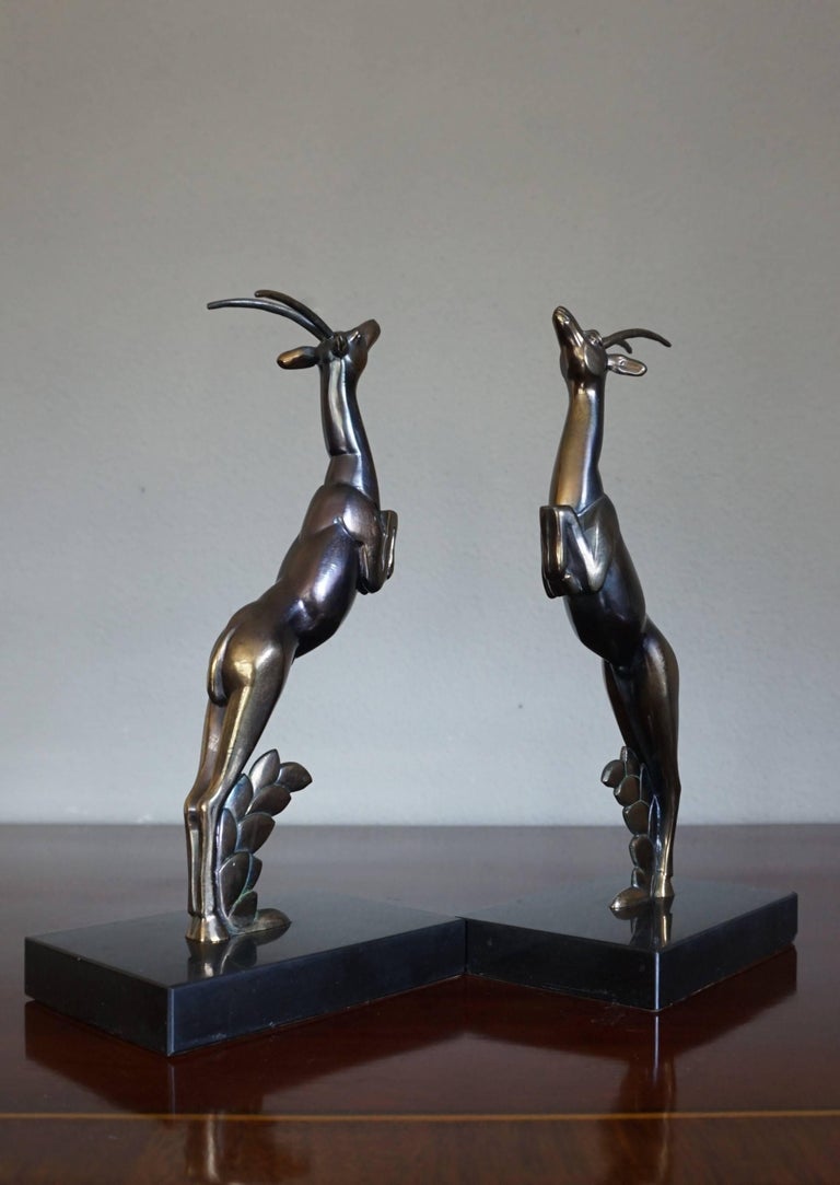 Higher than average bookends with elegant deer sculptures attributed to Marcel Bouraine.

This highly stylish pair of hand-sculpted deer bookends is from the heydays of the Art Deco period in early 20th century France. These strong and gracious