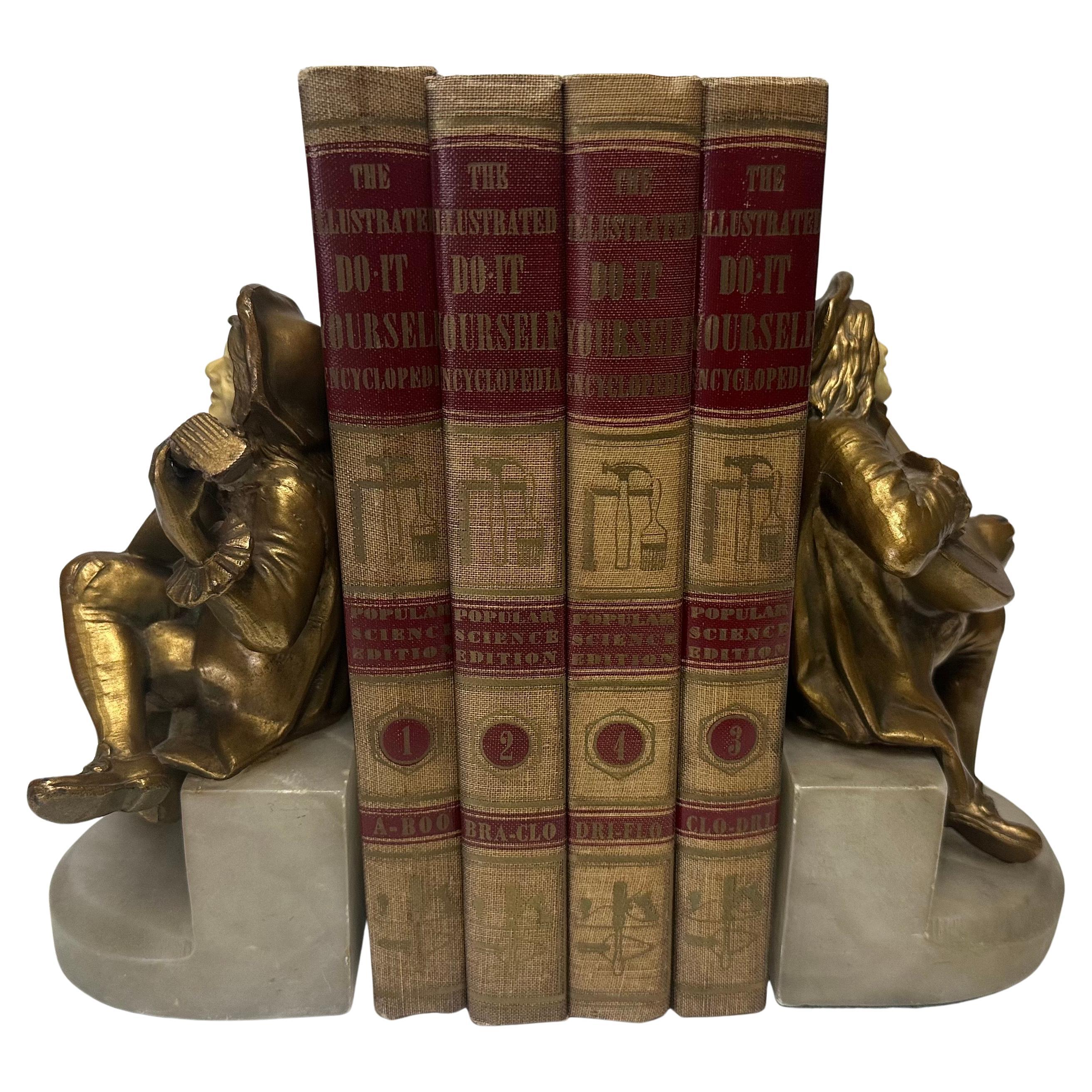 Ottone Pair of Art Deco Brass Minstrel Bookends on Marble Attributed to DAV ART NY in vendita