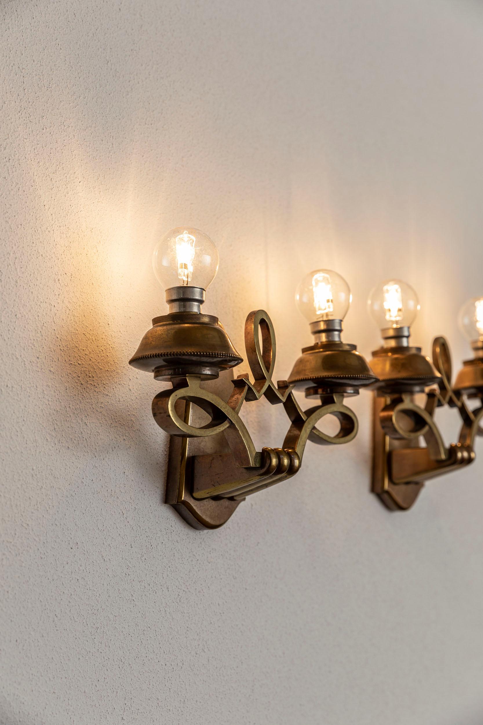 Mid-Century Modern Pair of brass sconces, Jules Leleu style For Sale