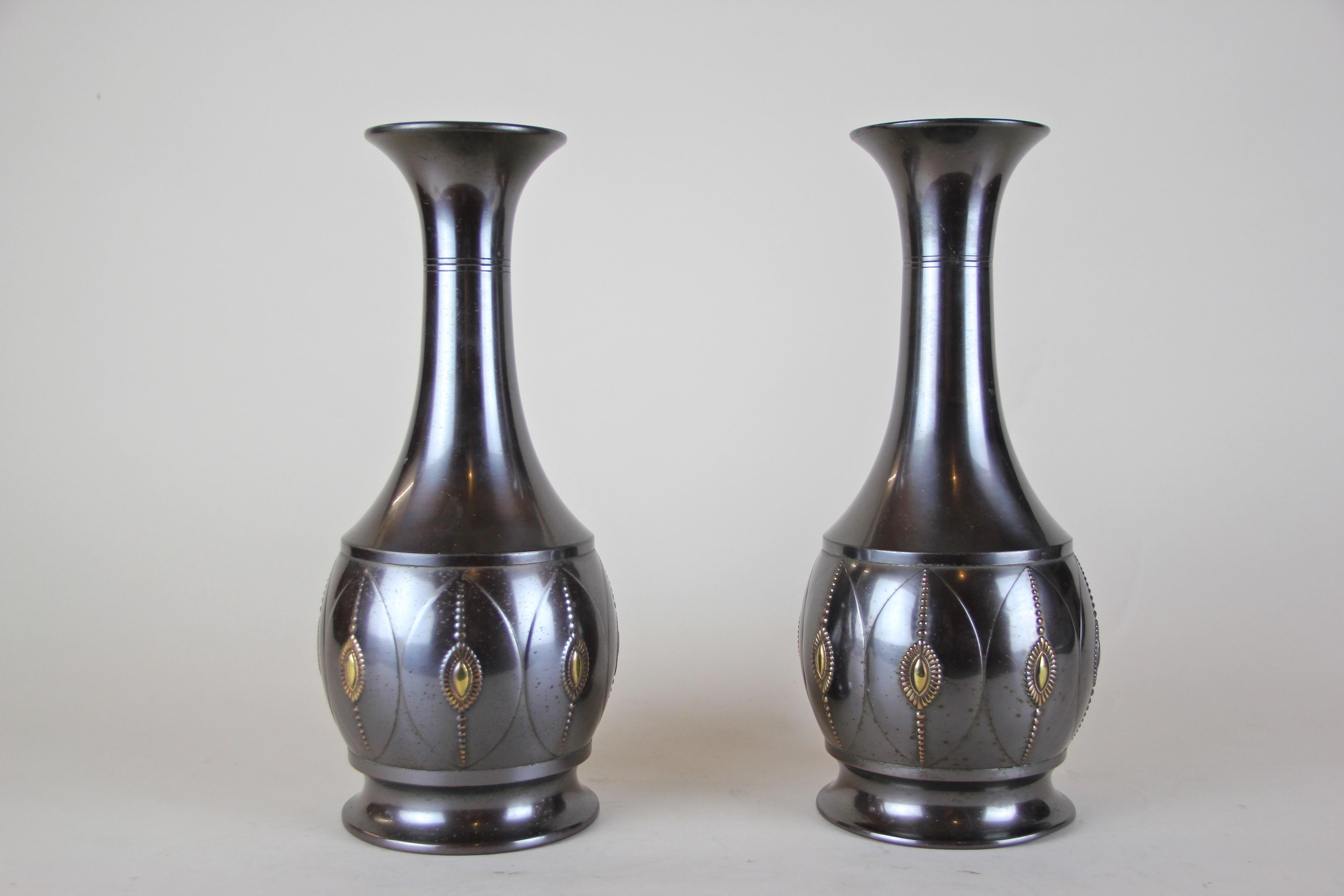 Beautiful pair of Art Deco brass vases by KMD from the Netherlands, circa 1920. Showing a great shaped body, these decorative vases were made of fine brass and show a nice dark grey/ black surface. Hallmarked at the bottom 