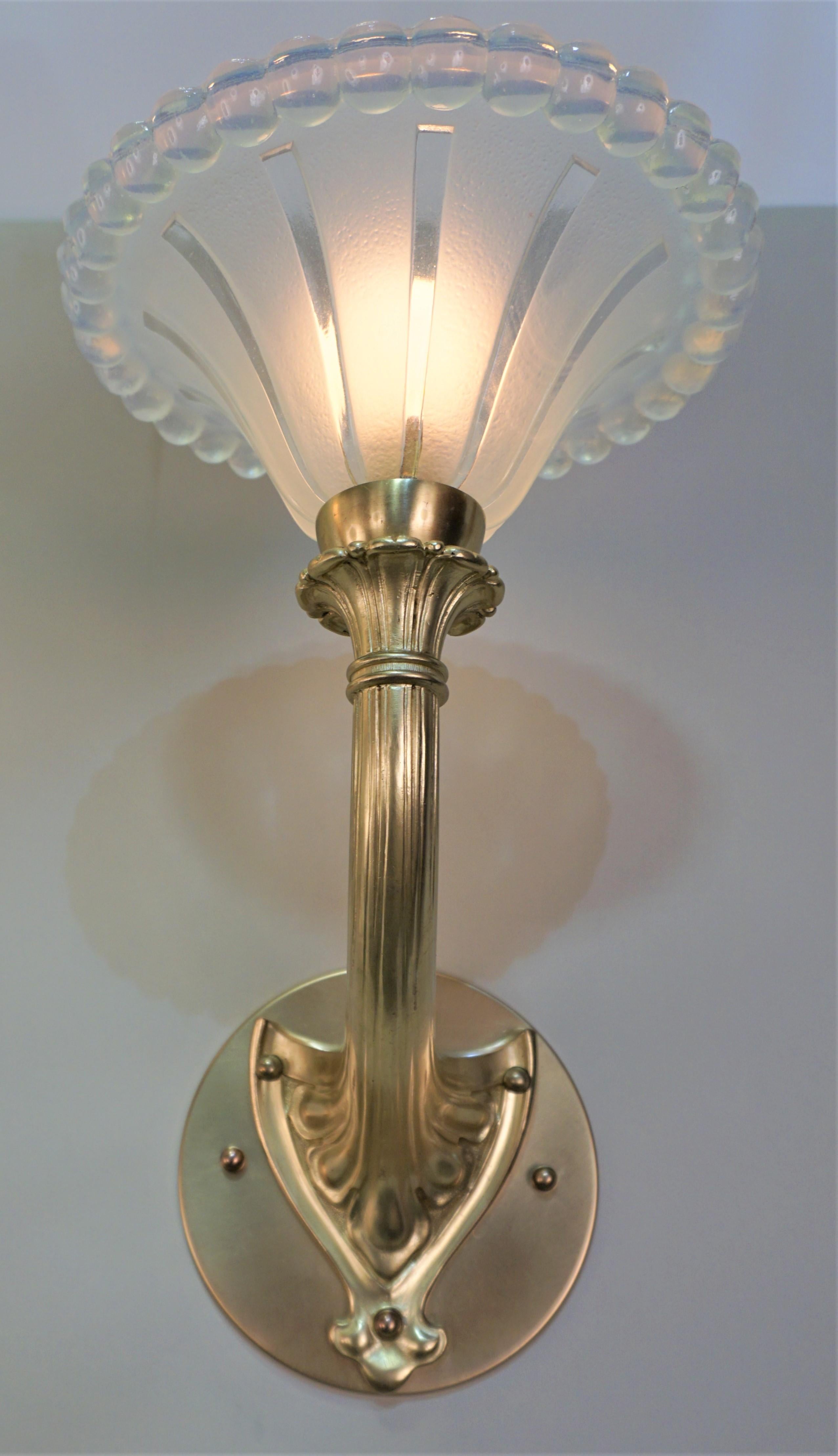 Pair of 1930's art deco bronze wall sconces with clear frost opaline glass (light honey blue) wall sconces
Back plat is 6