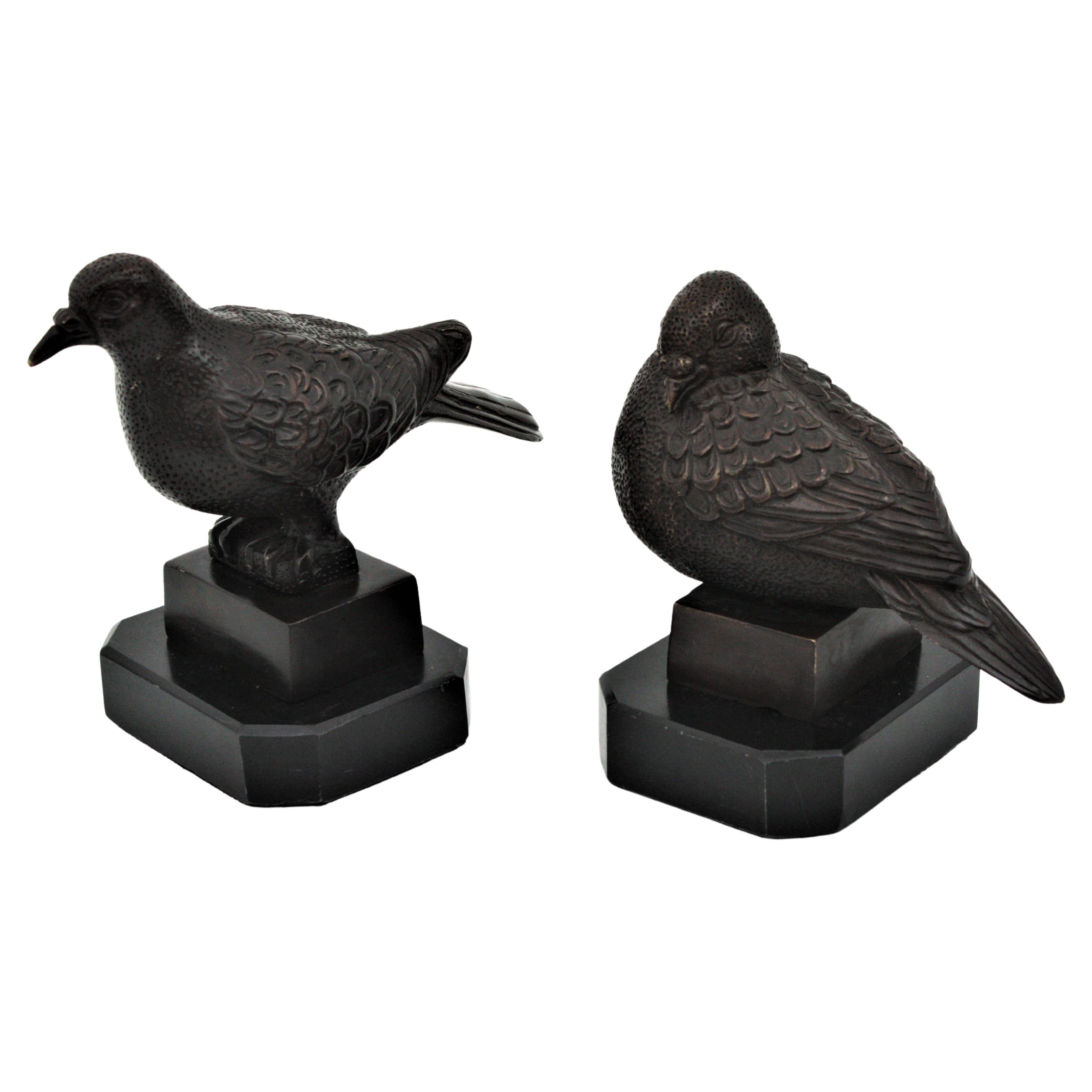 Unmatching pair of bronze dove bird sculptures or paperweights. France, 1930s
Art Deco sitting dove bird and standing dove bird figurines on black marble pedestals.
Measures: 
Standing bronze bird: 17 cm H x 17 cm W x 11 cm D
Sitting bronze