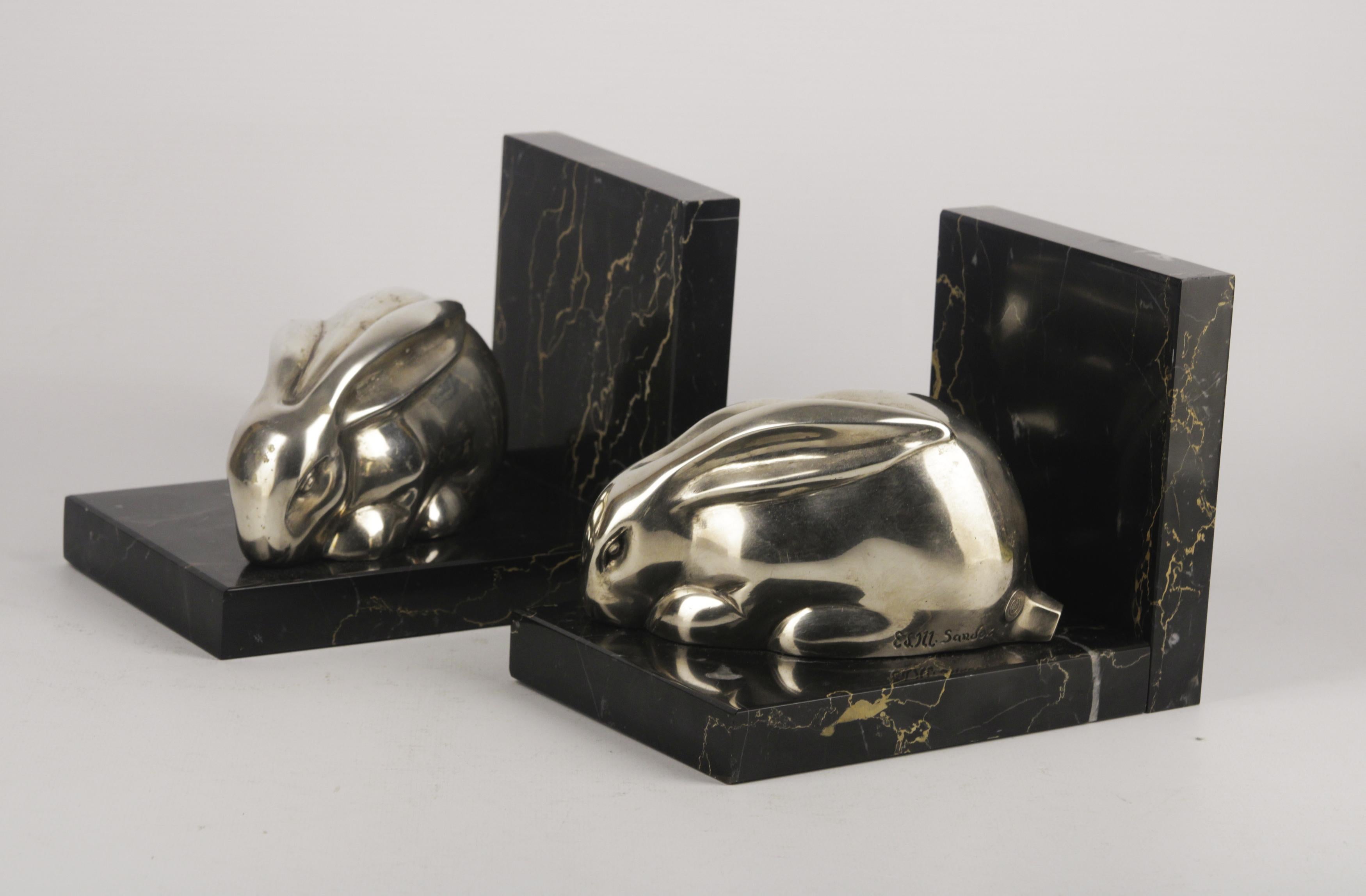 Pair of Art Deco bookends rabbit figure signed E.M. SANDOZ and Susse Frères .Silver plated bronze and black marble base. Origin France. Circa 1930.Perfect condition. Measures: 13x17x11cm each one. 
The Susse Frères firm was established in 1839 by