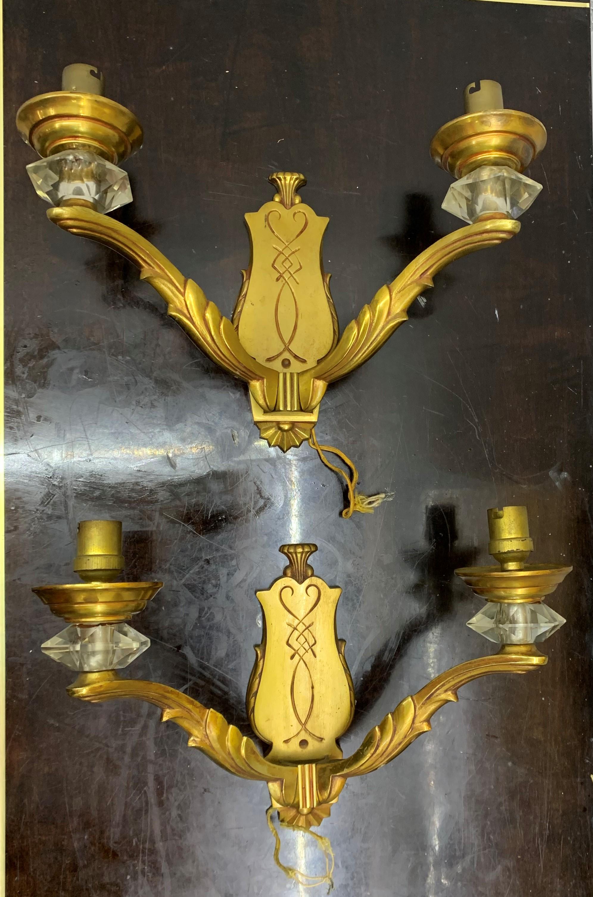 Beautiful and original Art Deco bronze and crystal sconces, both stamped in the back G. L. (Georges Leleu) 71 (model number).
They can be polished if the client desires it and will be rewired as they currently have the original fabric covered