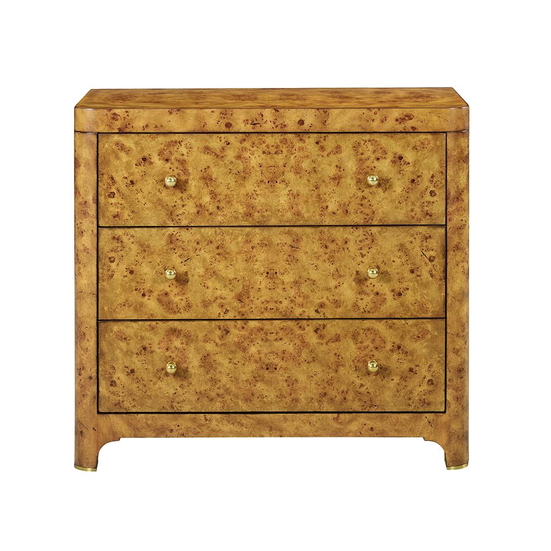 Crafted with a stunning rustic Mappa burl wood veneer, its golden honey tones and intricate wood grain patterns evoke a sense of warmth and sophistication. 

Featuring three spacious drawers adorned with sleek brass pulls, this piece combines