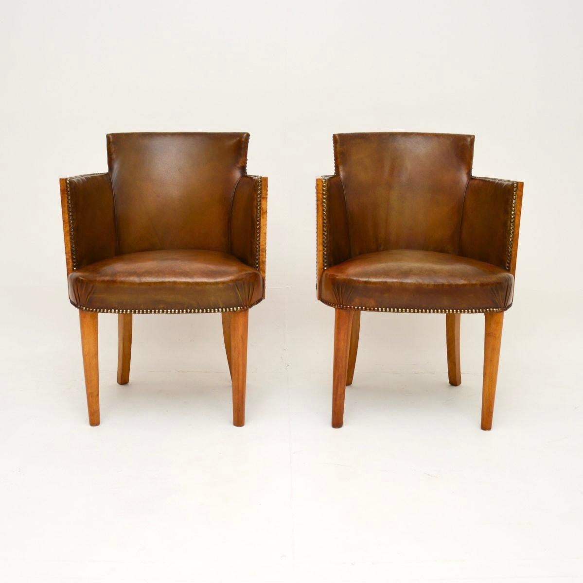 A very smart and stylish pair of Art Deco burr walnut and leather armchairs. They were made in England, they date from the 1930’s.

The quality is outstanding, they are beautifully crafted and are a lovely size. They are very comfortable and look