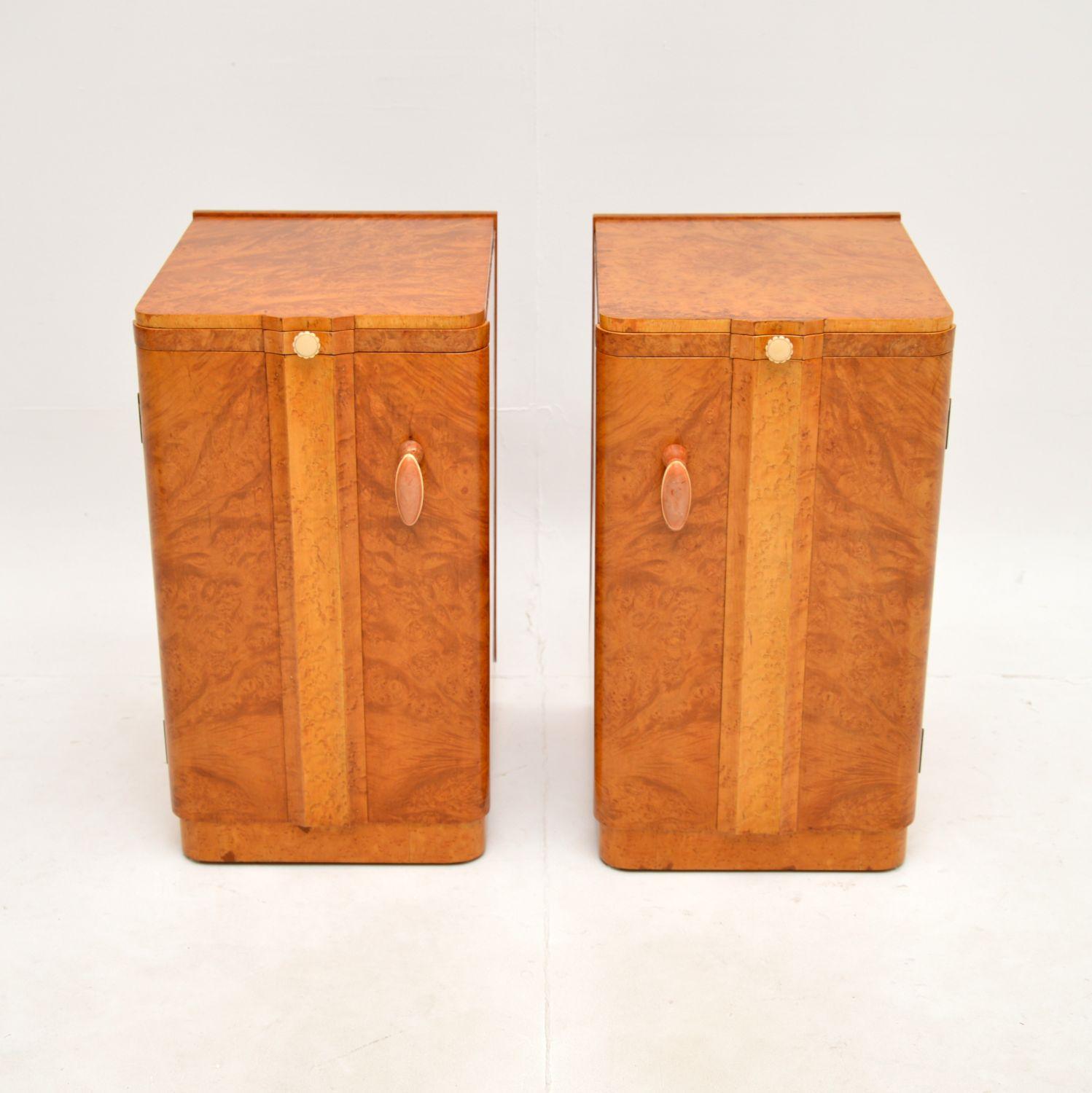 A stunning pair of Art Deco burr walnut bedside cabinets. They date from the 1920-30’s, they were made in England by Epstein.

The quality is outstanding, they are beautifully designed with lovely original bakelite handles. The fronts are nicely