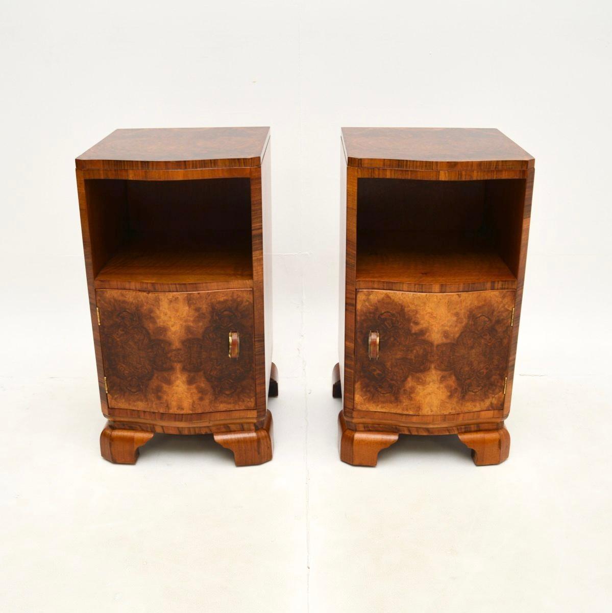 A fantastic pair of Art Deco burr walnut bedside cabinets. They were made in England, they date from the 1930’s.

The quality is exceptional, they have a bow fronted design, sit on lovely bracket feet and have lot of storage space inside. The