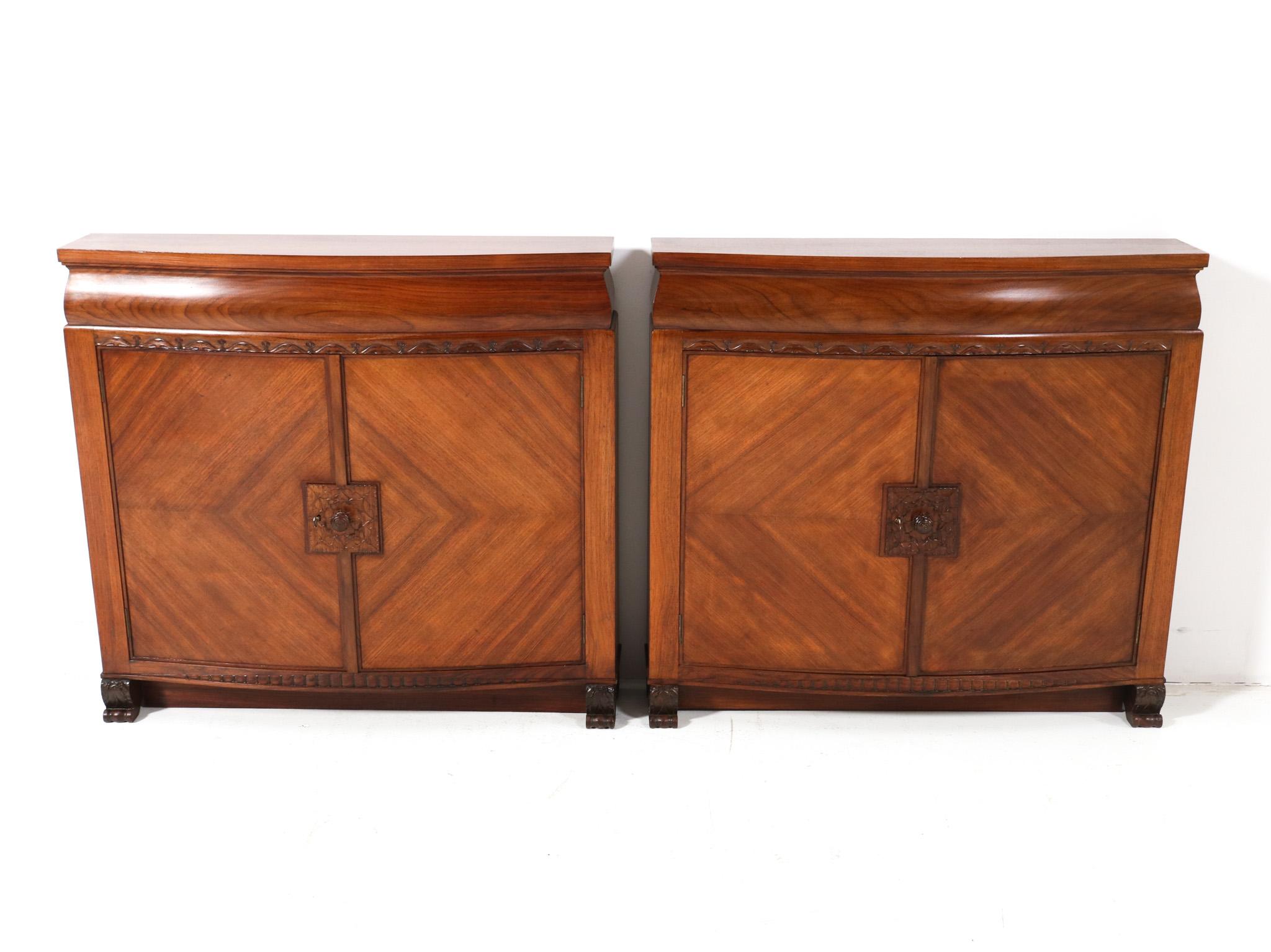 Magnificent and rare pair of Art Deco cabinets.
Design by Napoleon Le Grand for 't Modelhuis N. Legrand Amsterdam.
Striking Dutch design from the 1920s.
Solid padouk and original padouk veneer.
This wonderful pair of Art Deco cabinets by Napoleon Le
