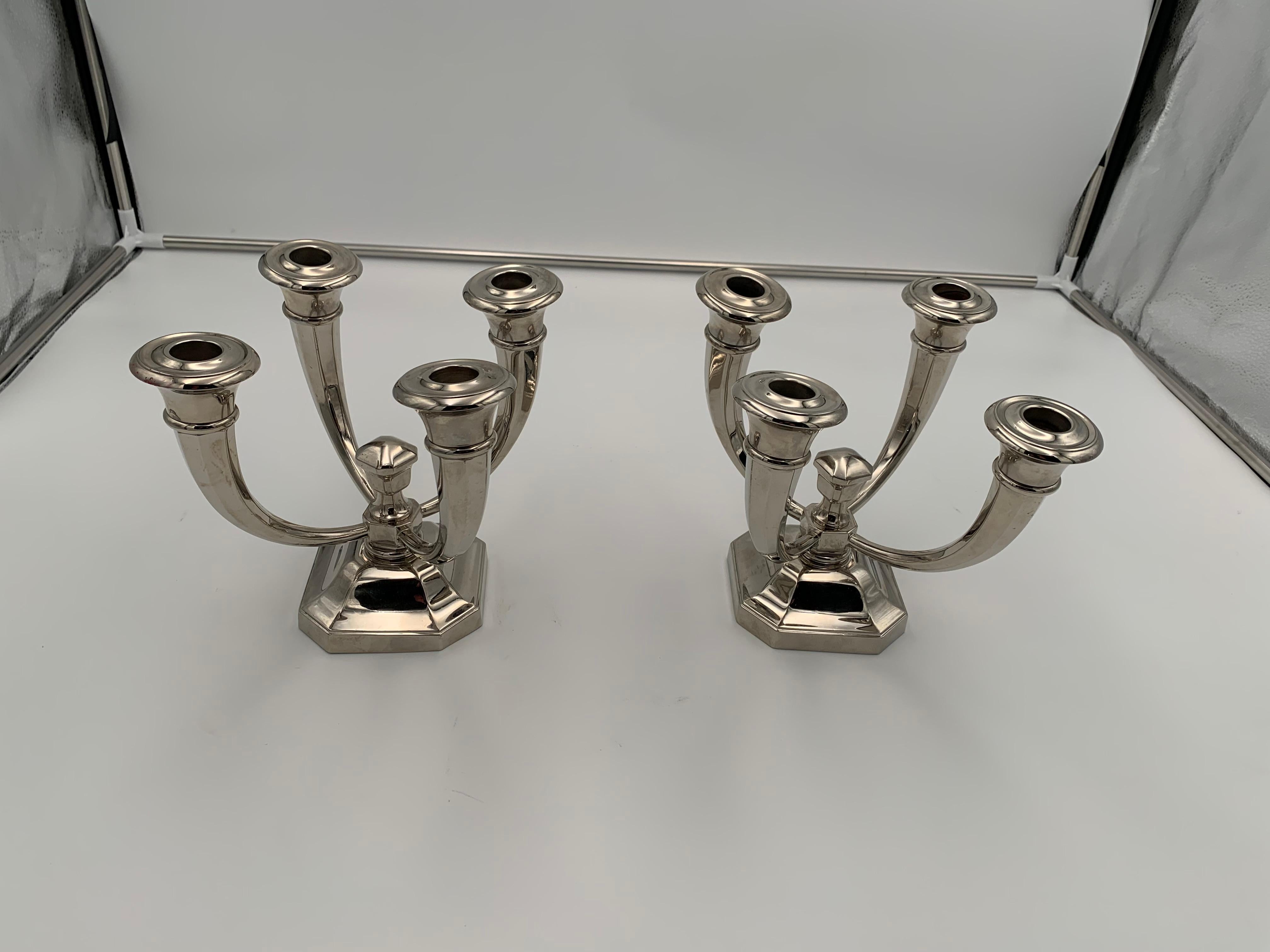 Pair of Art Deco candlesticks by J. Leleu, nickel-plated bronze, France, circa 1930.

Very fine and elegant pair of four-armed Art Deco candlesticks / candleholders / candelabras by Jules Leleu (1883 - 1961).
Excellent quality, heavy cast bronze
