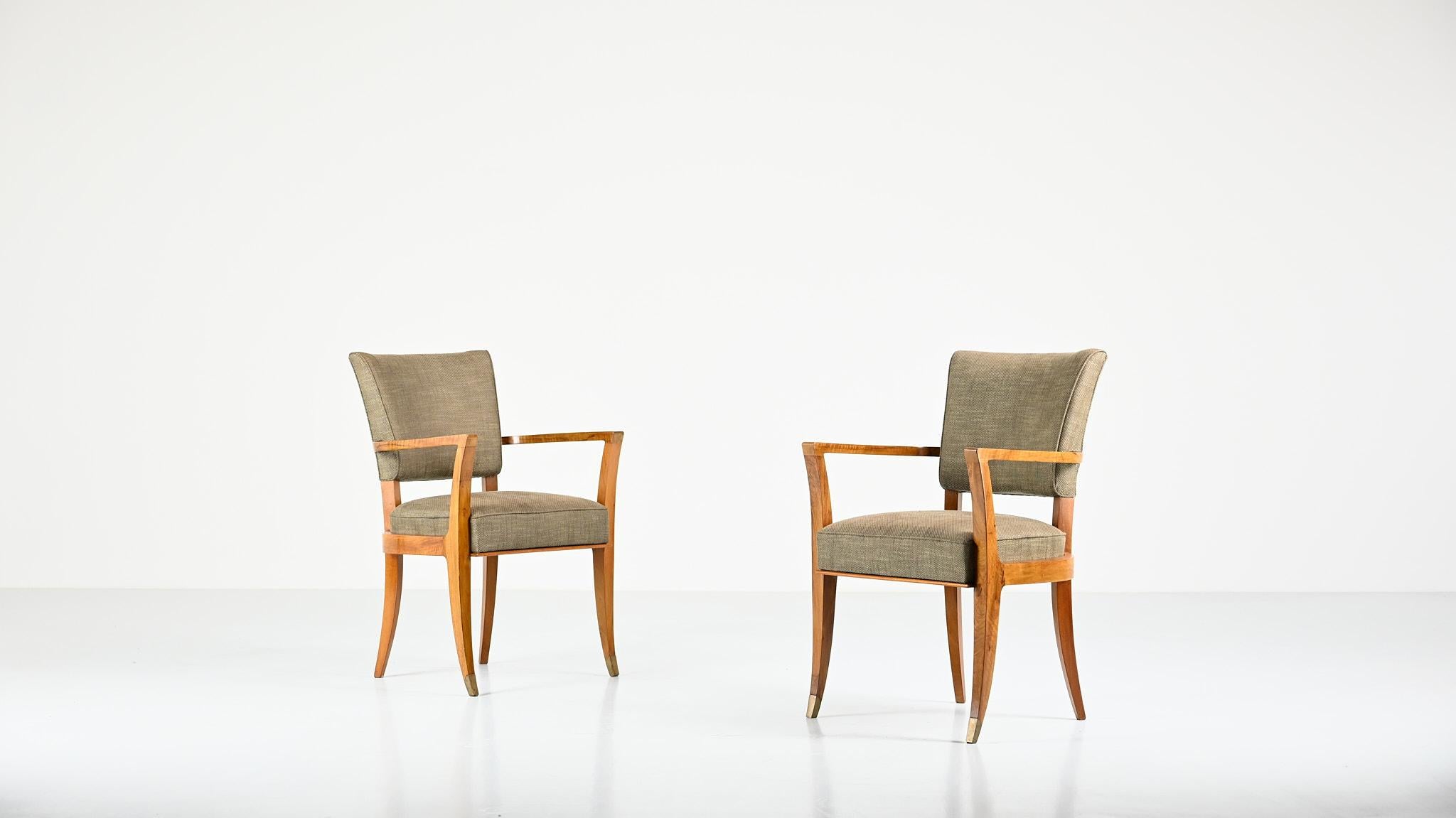 Pair of Art Deco bridge armchairs in solid walnut, enhanced with brass foot clogs. Traces of use on the varnish, reupholstered. Very good overall condition. C.1940.