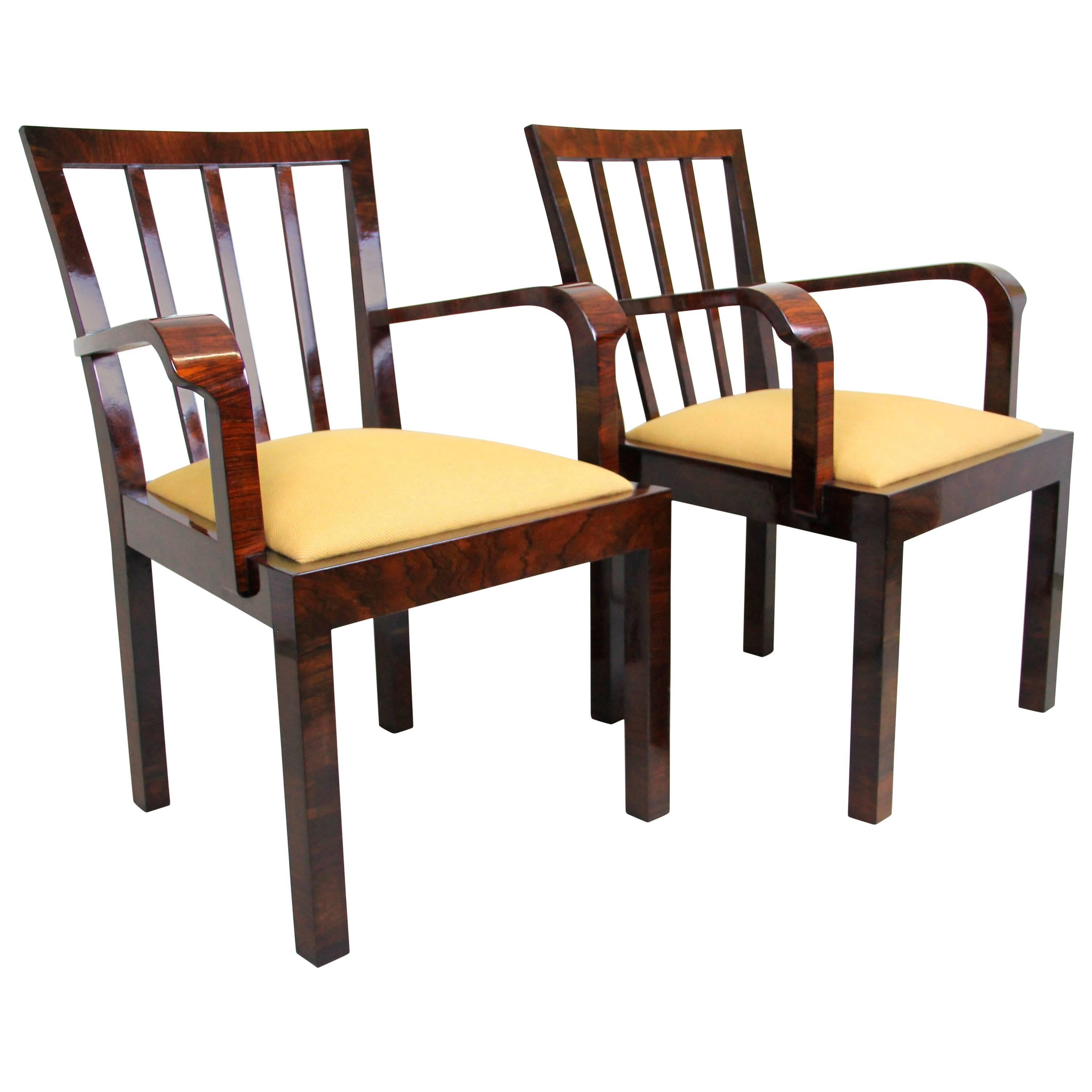 Stunning pair of Art Deco chairs handcrafted in Vienna - Austria during the period around 1930. A straight timeless design, veneered in great arranged nut wood and newly upholstered in premium Backhausen fabric makes this pair a fantastic edition to