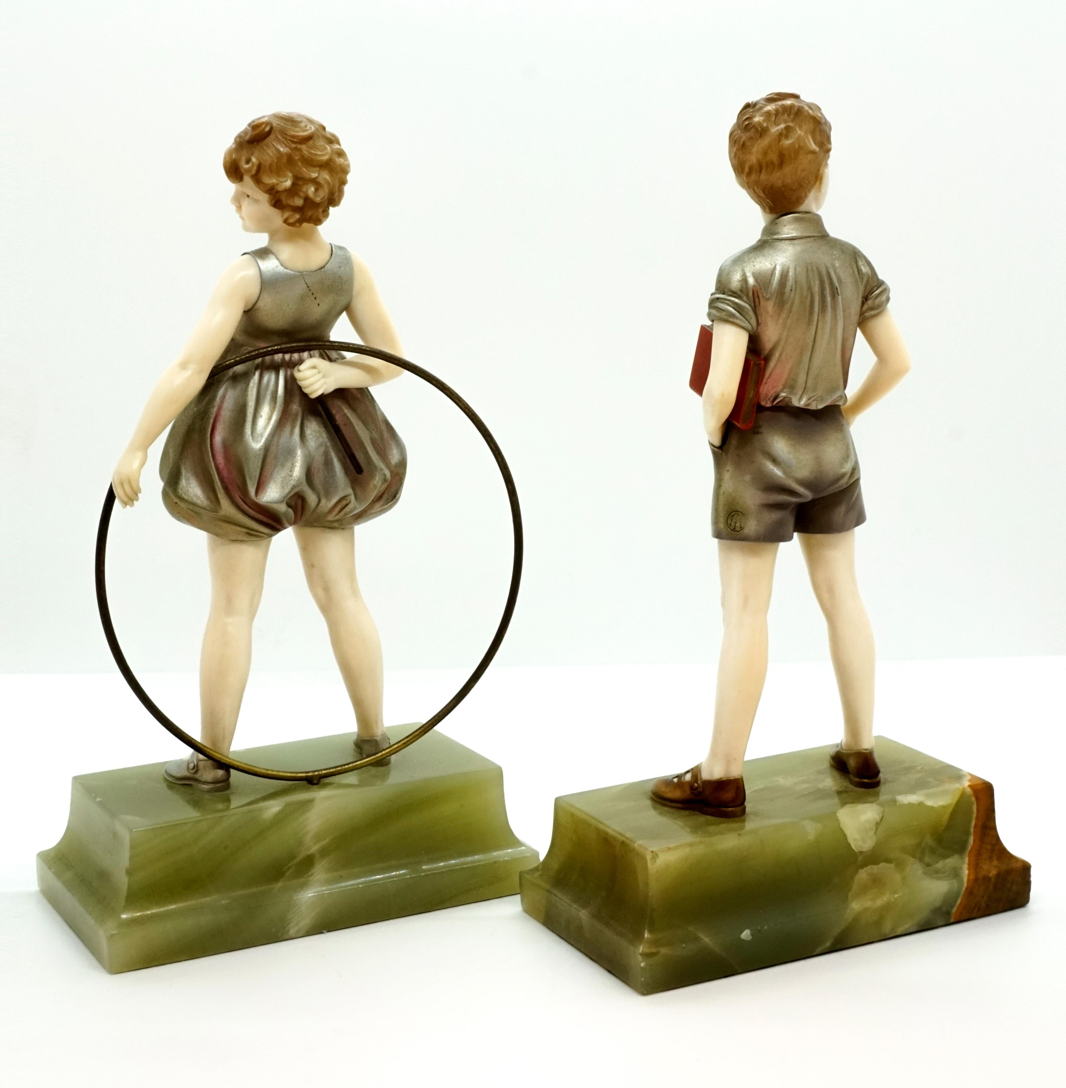 Hand-Carved Pair of Art Deco Child Figurines 'Hoop Girl' & 'Sunny Boy' by Ferdinand Preiss