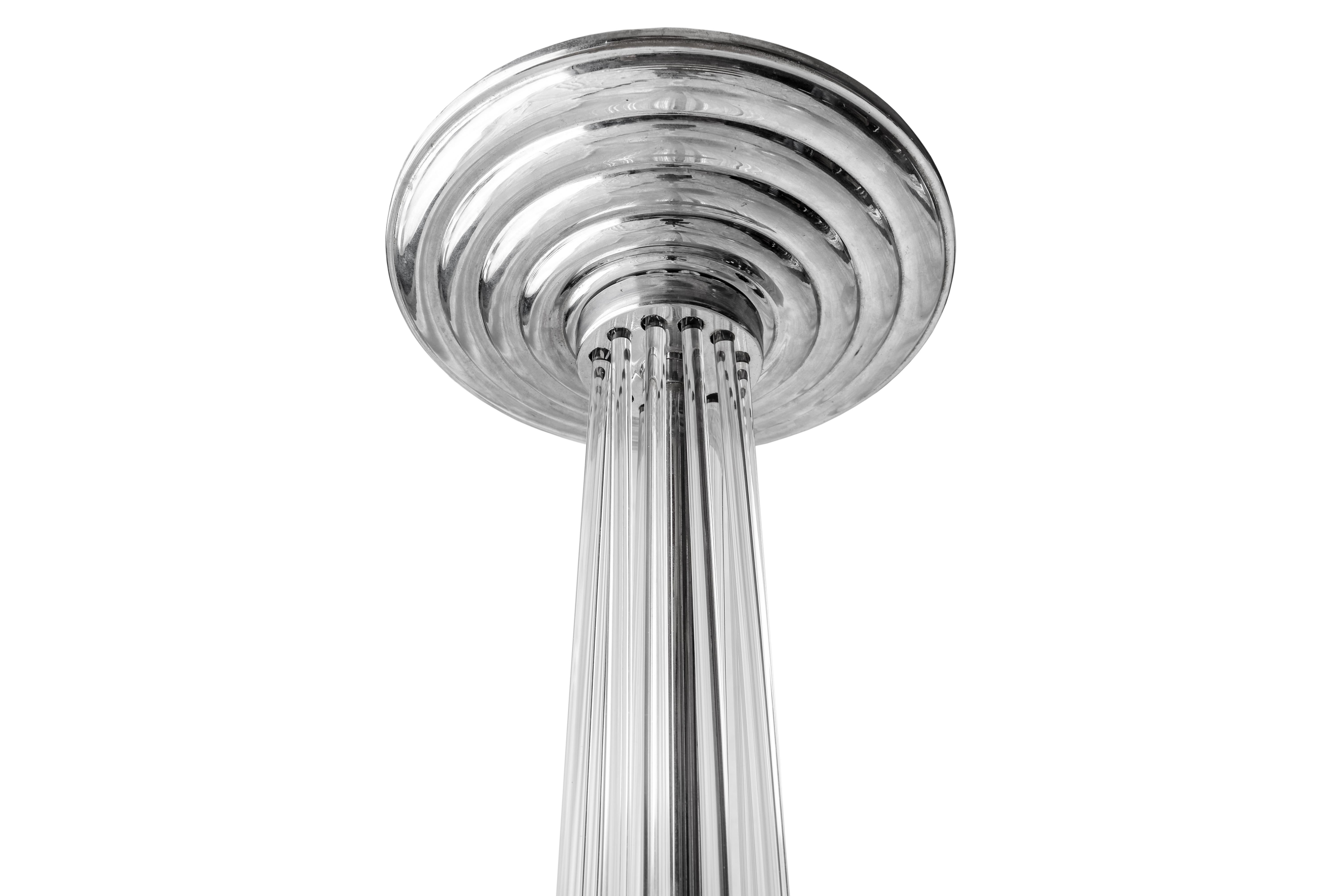 Pair of Art Deco Chrome and Acrylic Pedestals Stands Columns, 1930

Very elegant, rounded Art Deco Pedestal with plated base and top with black glass plate and acrylic rods. By spinning the top, the rods can be positioned in different angles. Its