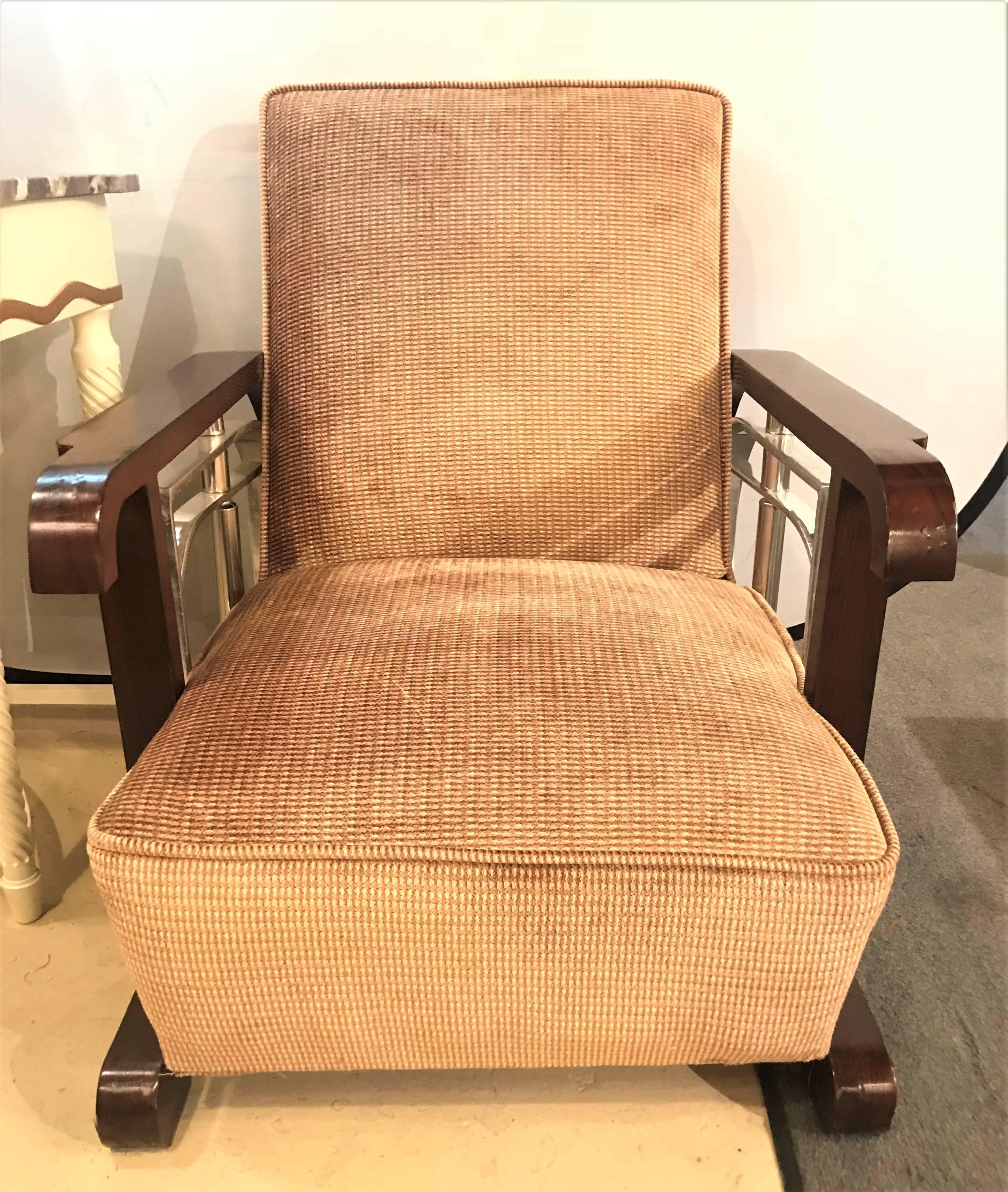 Pair of Mid-Century Modern Art Deco style lounge or theatre chairs. An outstanding set of Art Deco inspired lounge or theatre chairs from the Mid-Century Modern era. Each having all new fabric with new cushions, backrest, welts and undercarriage.