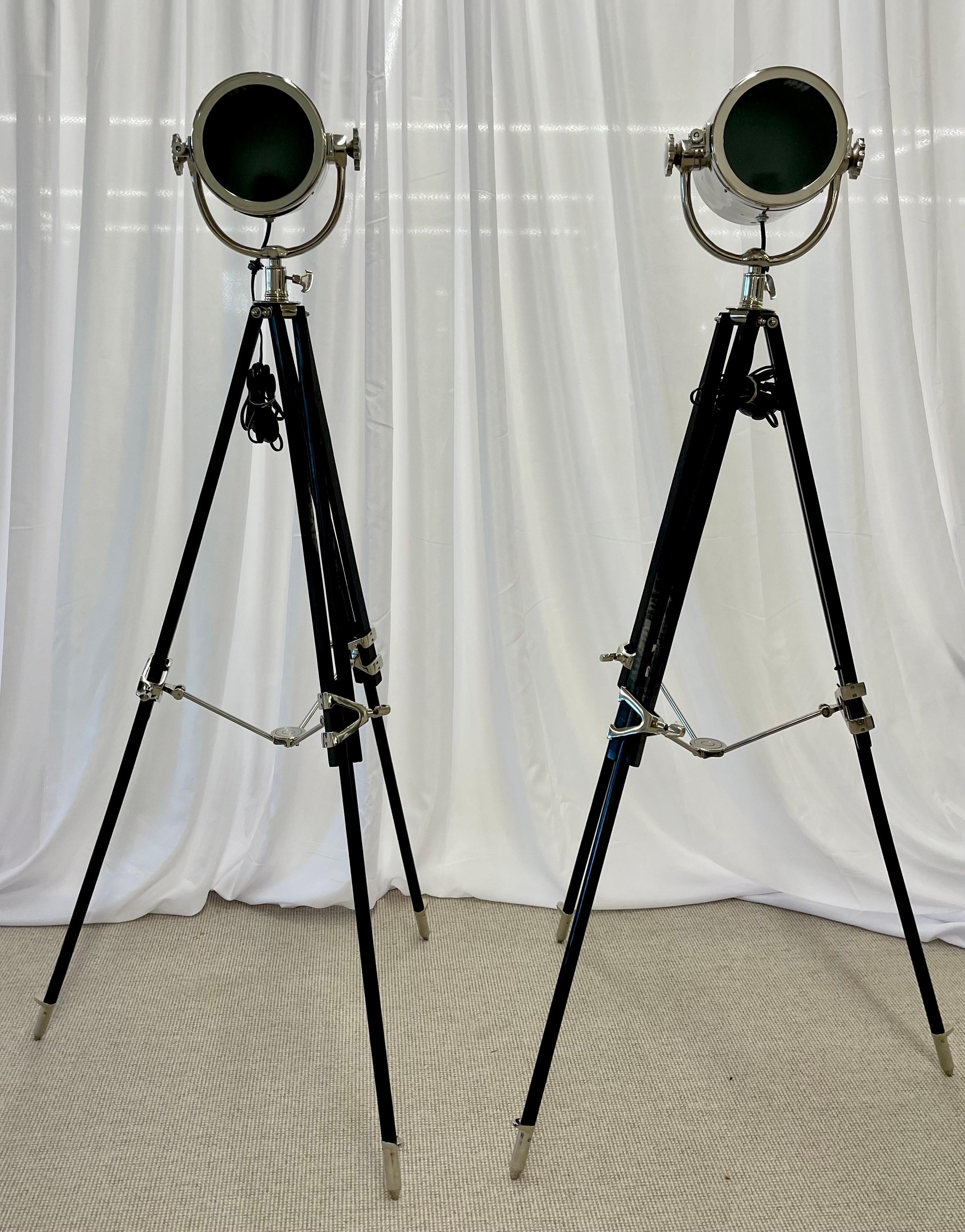 Pair of Art Deco Chrome spotlight floor lamps on Ebony Tripod bases

Pair of Art Deco chrome spotlight floor lamps on ebony tripod adjustable bases with adjustable upper extension. The light itself measures 8
