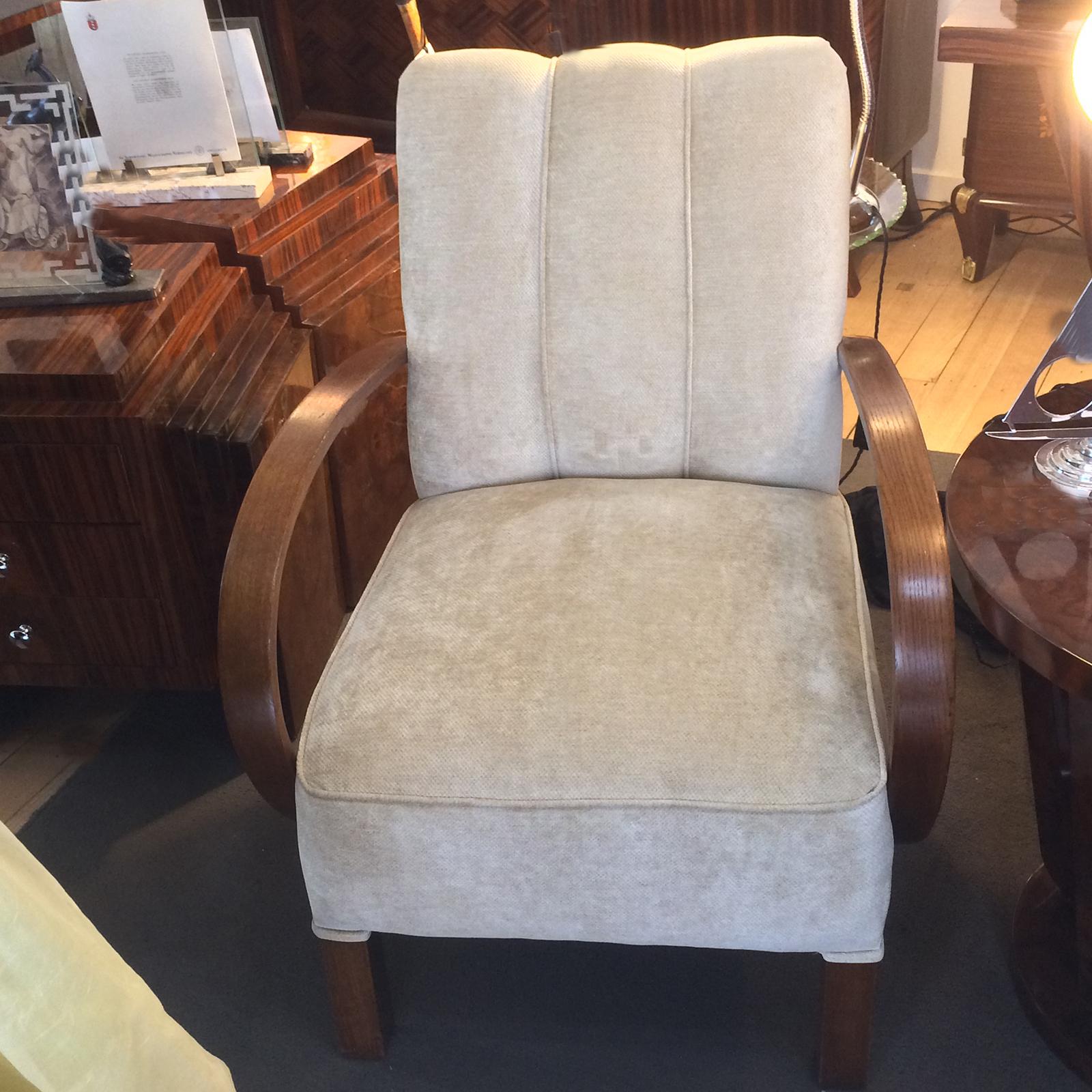 Art Deco German armchairs, totally re-upholstered. All piping, double piping to timber areas, folds, pleats, all totally re-produced as original, and all polished timber arms, and feet back to original. It would be difficult to find another pair as