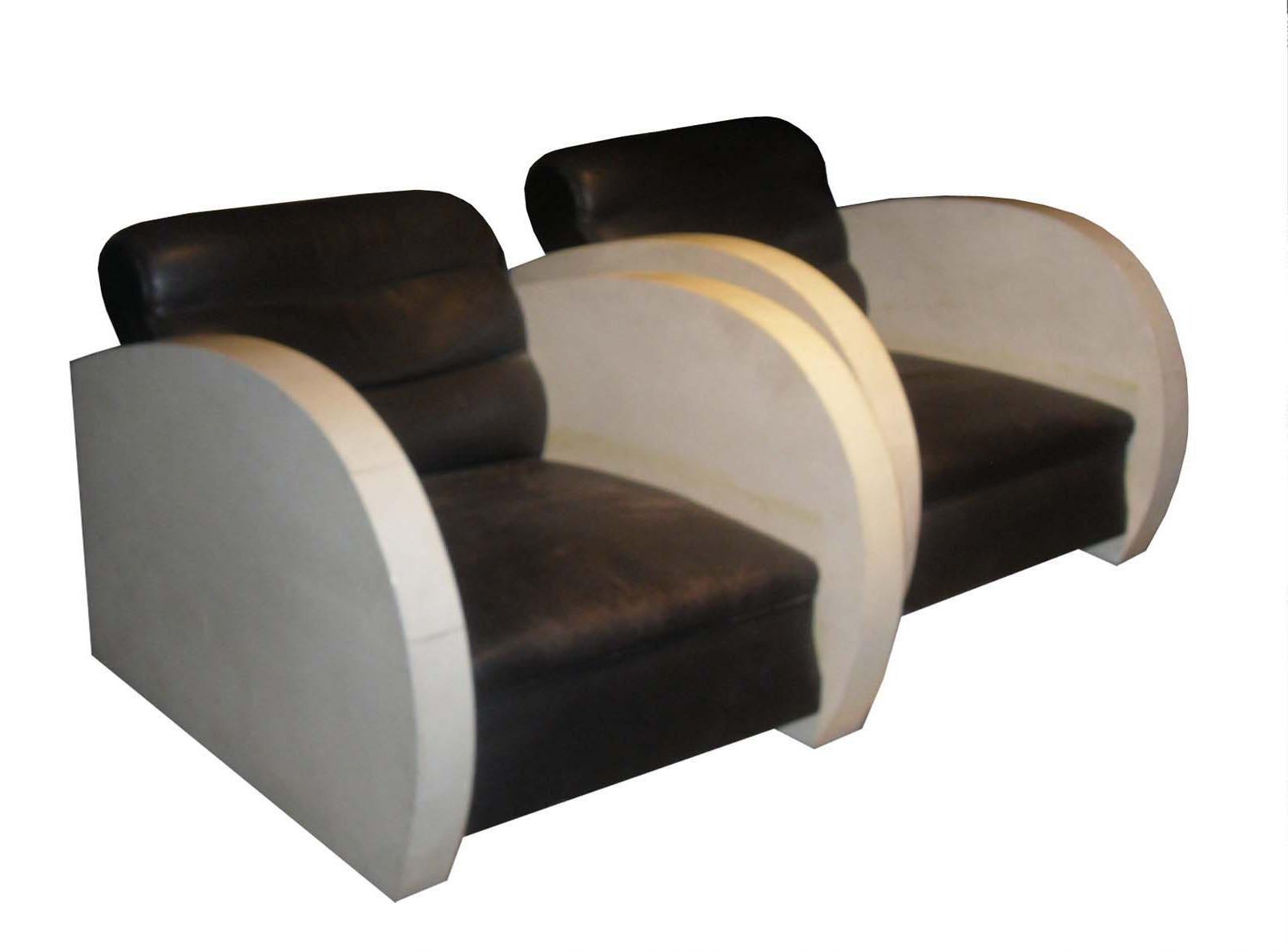 Pair of Art Deco club chairs in parchment and black leather.