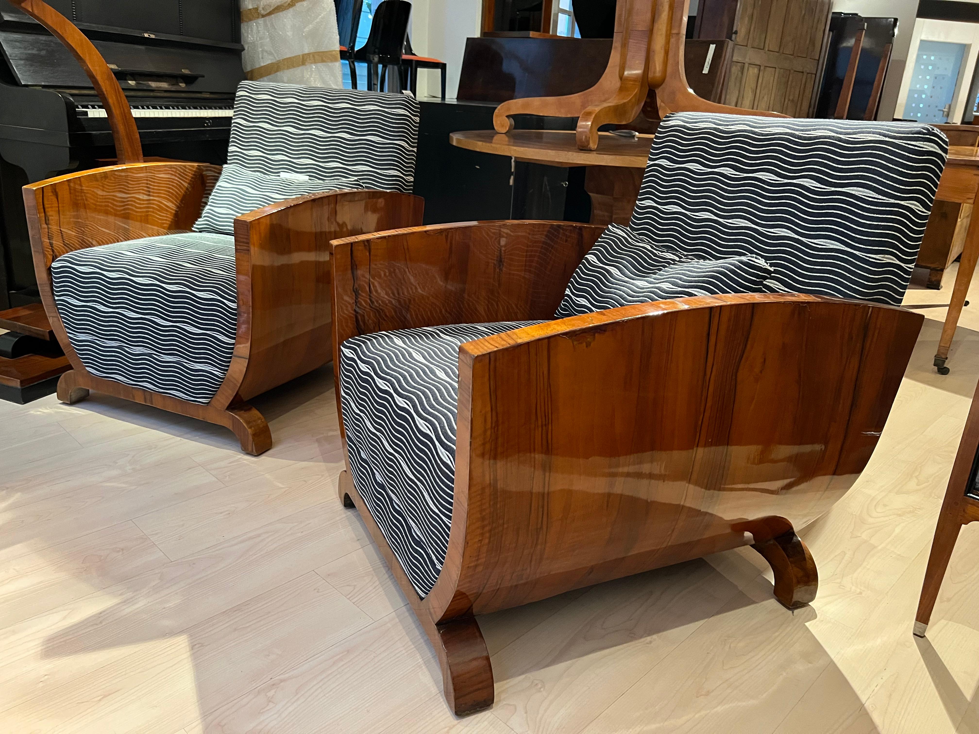 Very elegant Pair of Art Deco Club Chair from France, circa 1930.
 
Walnut veneered on soft wood, French polished.
 
New upholstery with a nice grey/white fabric from Backhausen, Vienna.
Very good seat-comfort. One optional cushion per chair is