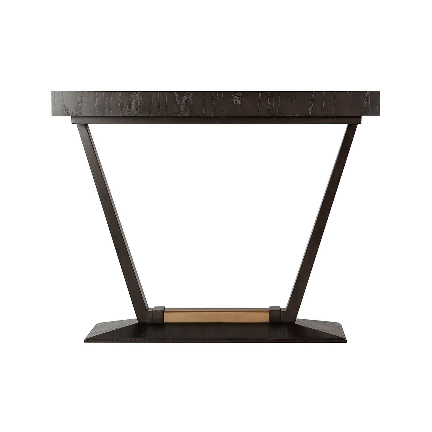 A French Art Deco style rectangular ash veneer top console table with a beveled base with a bronze finish accents and supported by angled tapered legs.

Dimensions: 39.75
