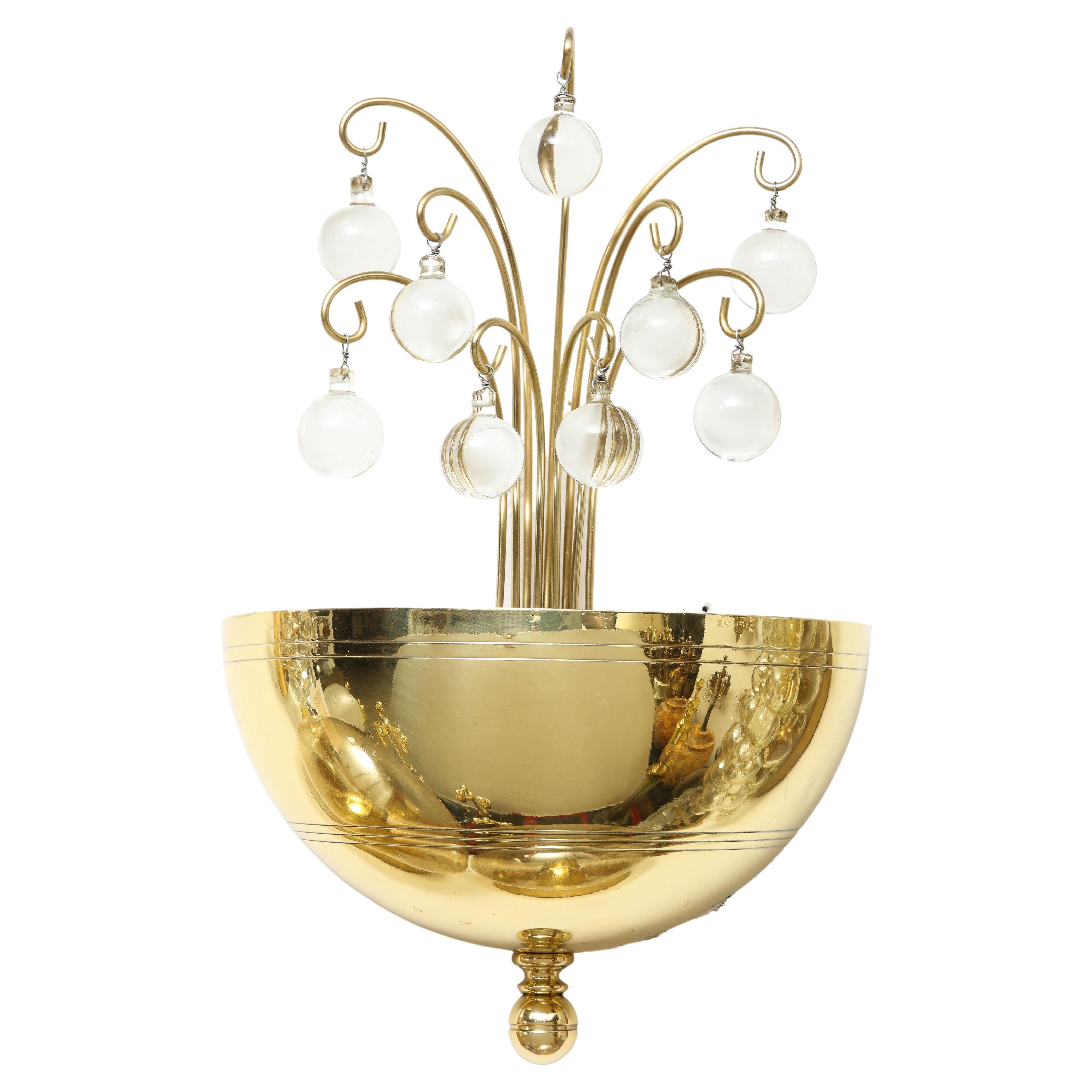 Authentic Pair of 1940's Art Deco brass and crystal ball sconces.
The Demi lune brass fixture supports a brass spray which holds the crystal balls and is illuminated by single light source which has been Newly rewired.
   