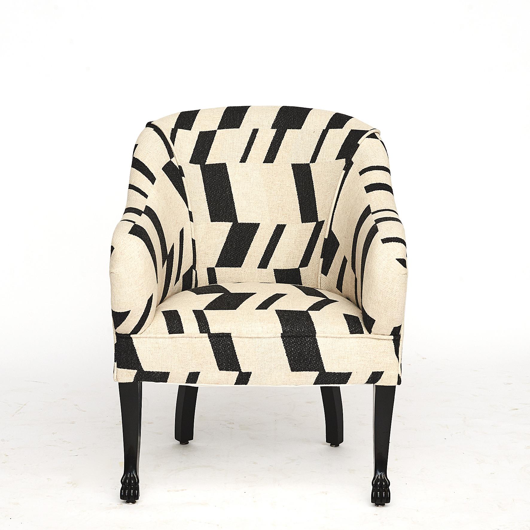Pair of Danish Art Deco easy chairs, Denmark, circa 1920.
Black lacquer mahogany legs ending in animal paws. Coil springs in the seat.

Upholstered with graphic monochrome pattern high quality fabric from Nobilis.
The chairs are extremely