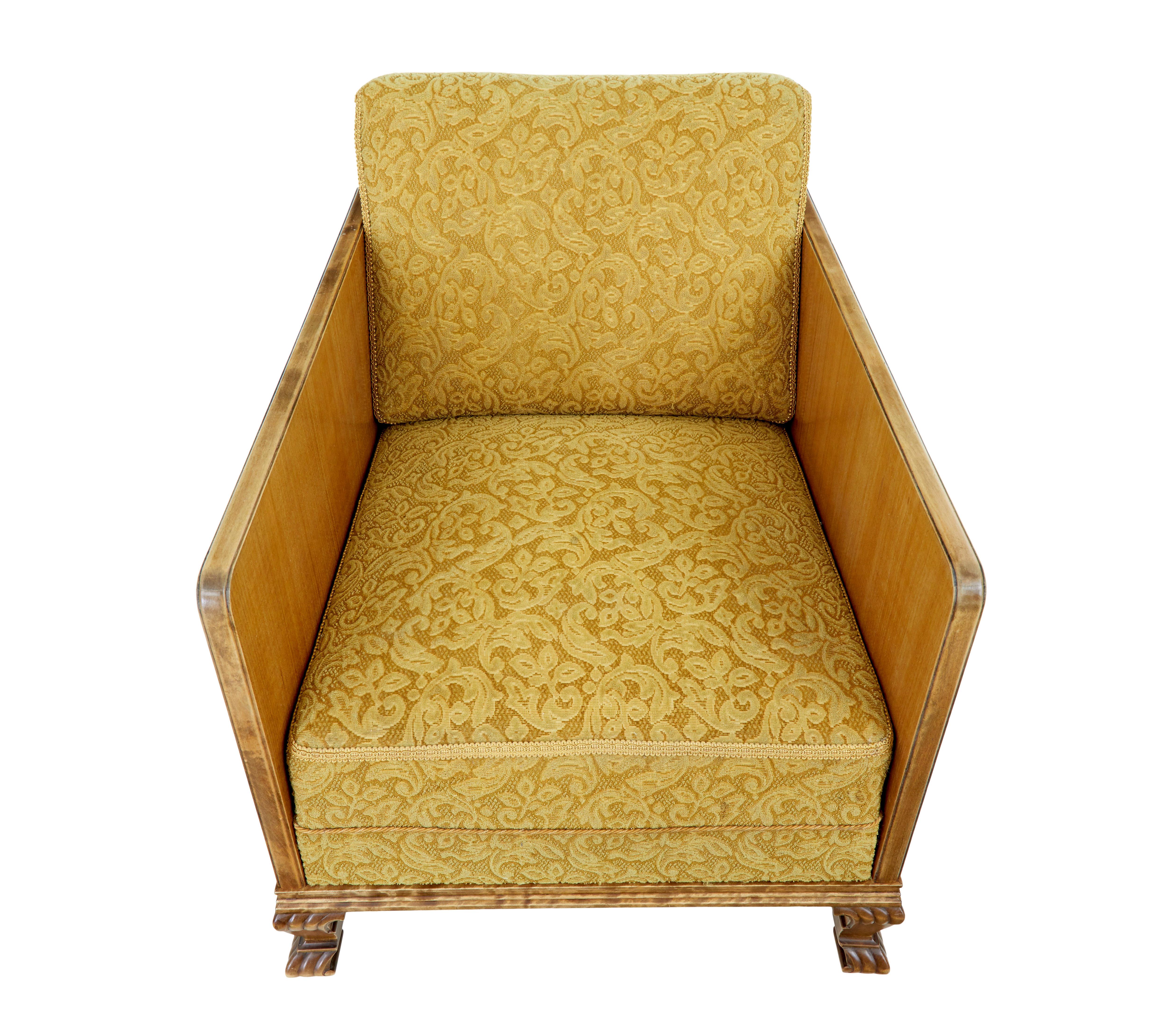 Pair of art deco elm and birch club armchairs circa 1930.

Fine quality pair of Scandinavian elm armchairs, thin elm side frame with mahogany stringing and contrasting walnut detail, complete with applied stained birch motif. Standing on front