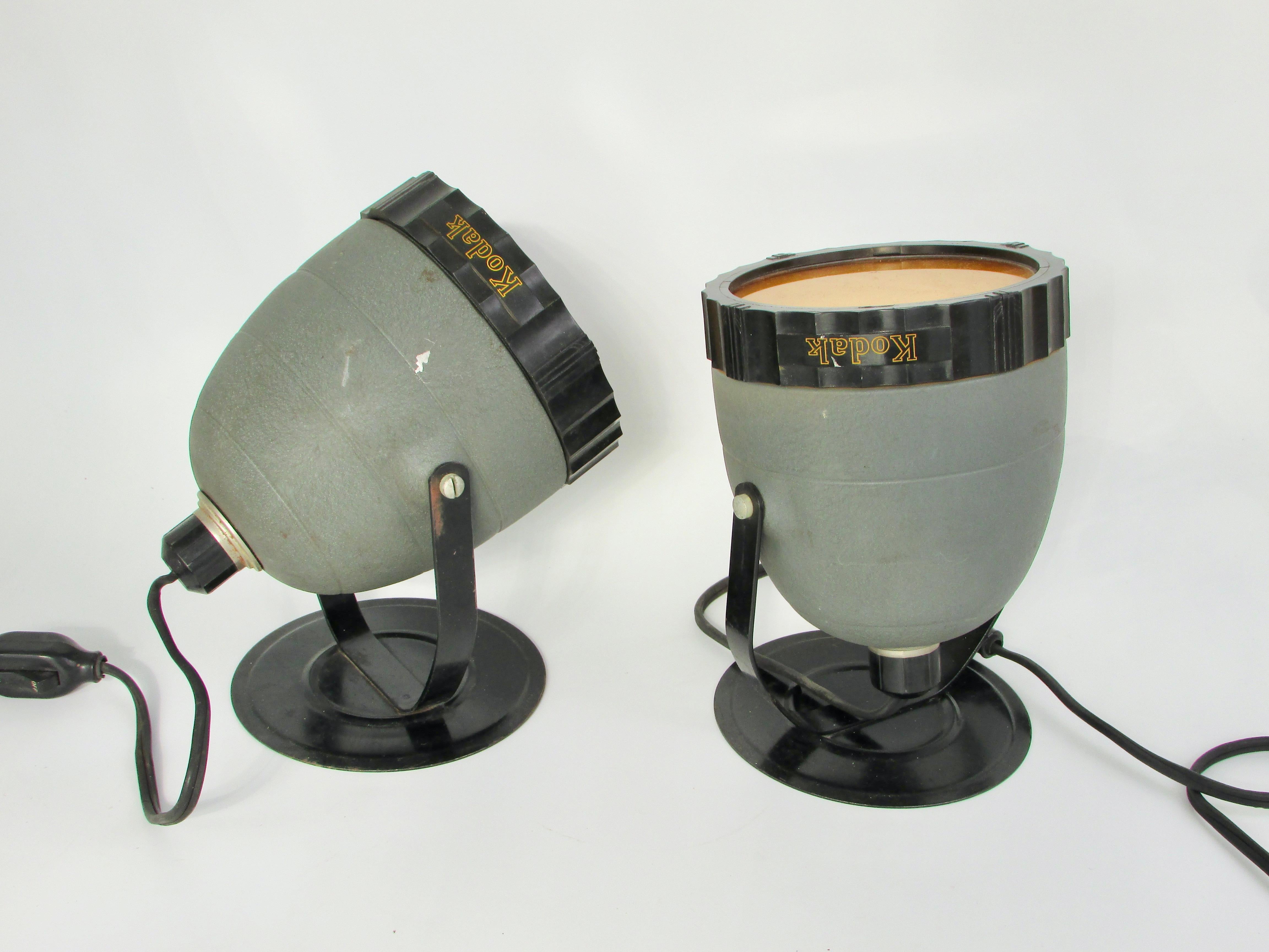 Pair of Eastman Kodak photography lamps in the Art Deco style . Recent estate purchase shown as found . Original cords and switches in fine working order . One lamp retains wall mounting flange .