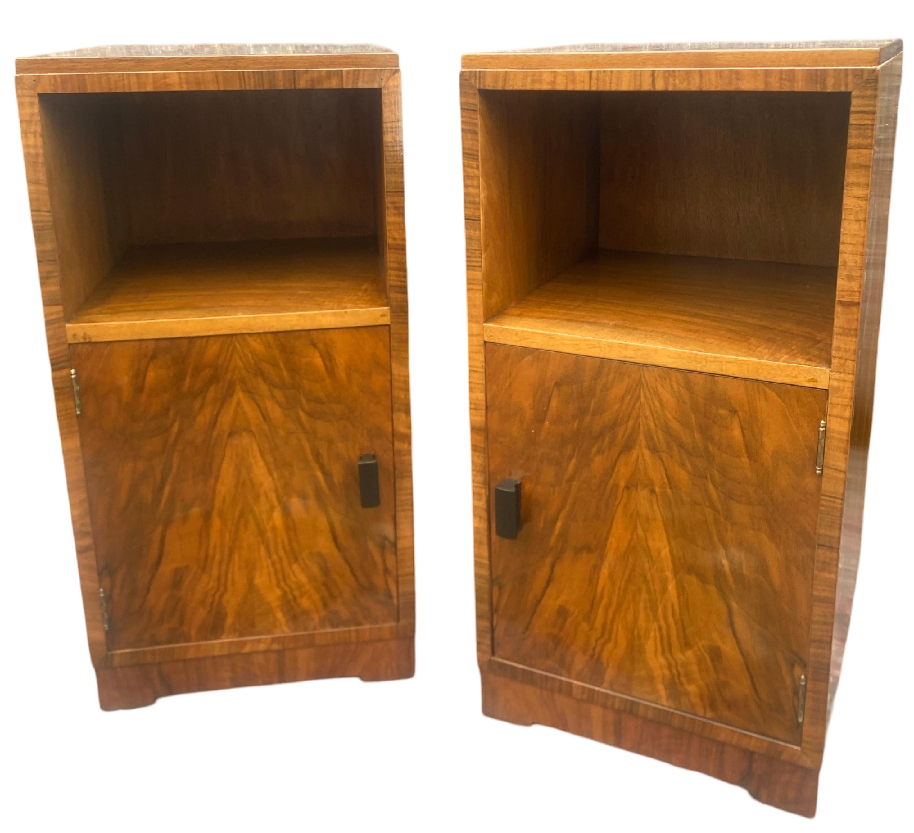 A gorgeous pair of Art Deco Bedside Cabinets/nightstands in figured walnut. A lovely warm colour, just like a newly opened conker, these cabinets are lined in walnut. The tops and doors are an exact match of beautiful figured book paged veneers.