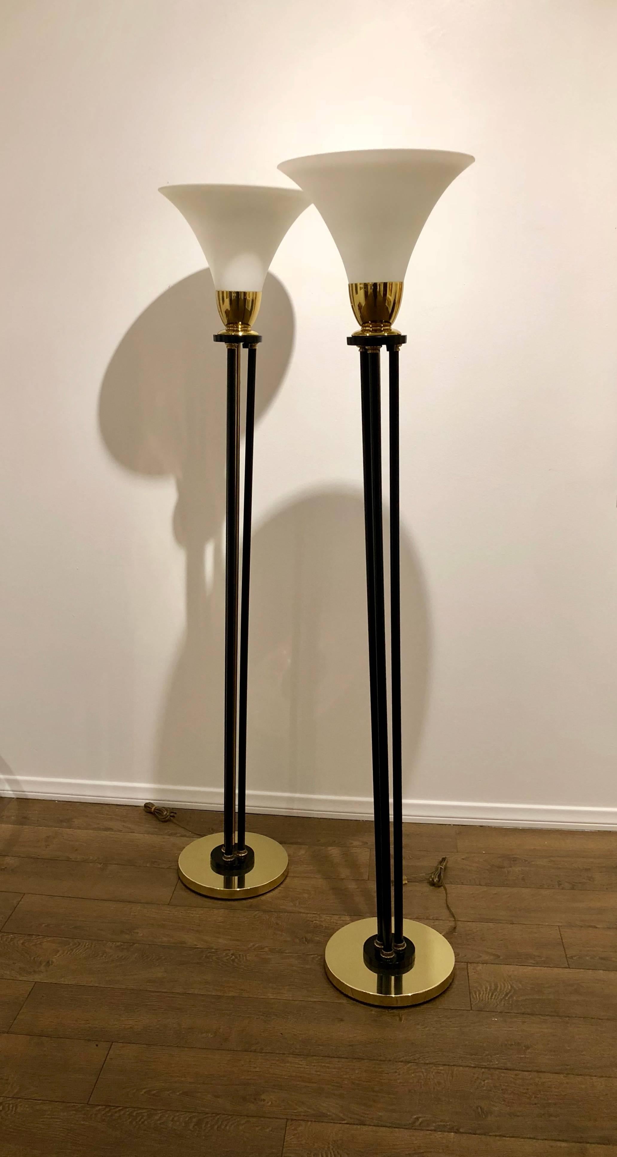 Hard to find pair of floor lamps with black enamel finish metal and brass fittings with beautiful frosted white glass lamp shades, circa 1970s.