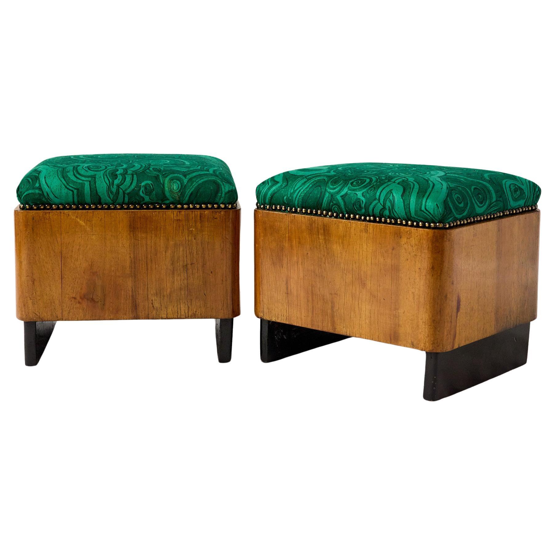 Pair of 20th Century Art Deco Footstools of Burled Walnut, Italy, Circa 1930s.

The small poufs are rectangular in shape with the frame beautifully veneered in a burled walnut and raised on a pair of inset black lacquer feet. The cushioned tops have