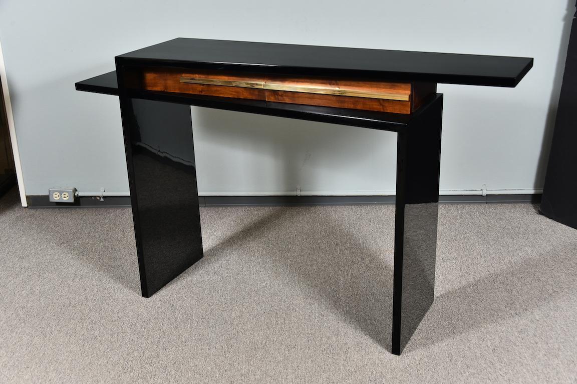 Very unique asymmetrical console made from regular and ebonized walnut wood, creating strong coloristic juxtaposition. Console has 2 spacious drawers with wide brass handles. 
Restored.
Condition is perfect.

French, circa 1930s.

Measures: 57” x