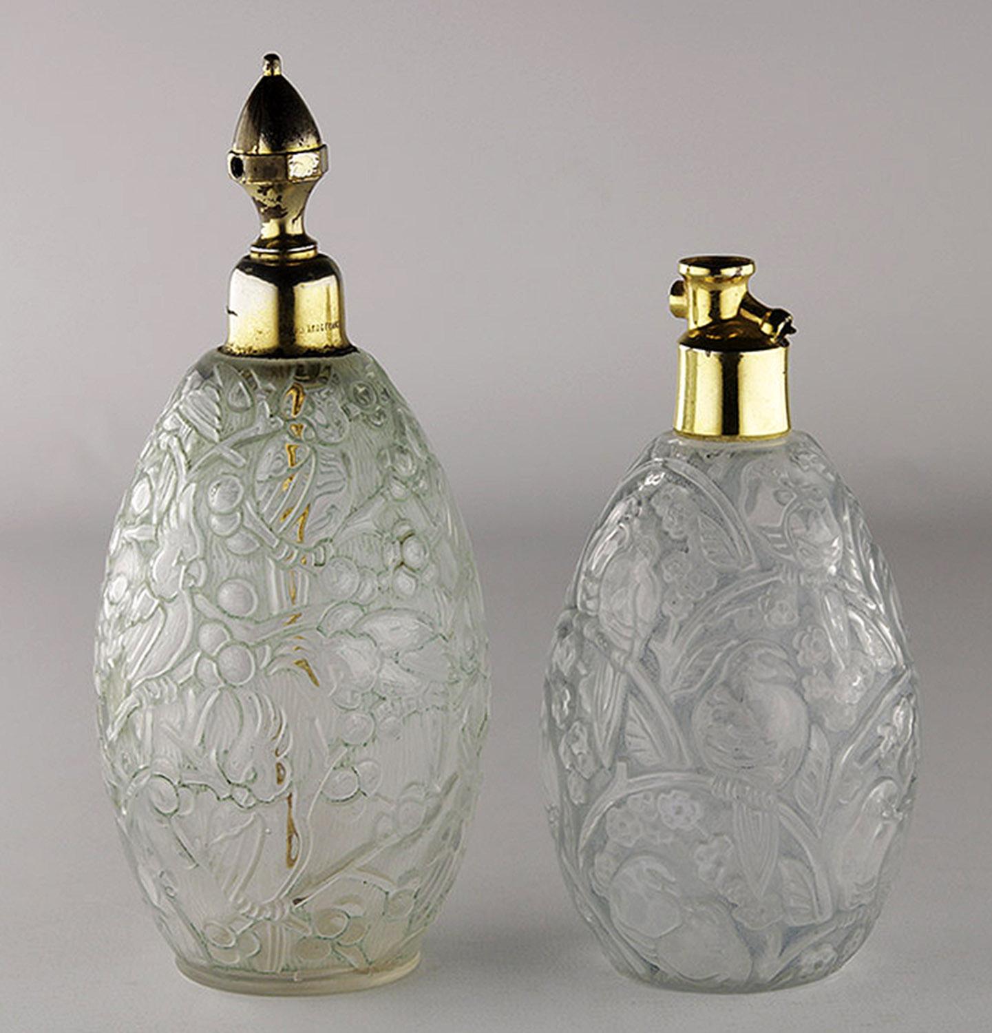 Pair of Art Déco french glass perfume bottles by ROBJ and Burgun & Schverer

By: ROBJ, Burgun & Schverer
Material: copper, glass, metal, silver, silver plate, crystal, cut glass
Technique: etched, molded, gilt, metalwork, silvered,