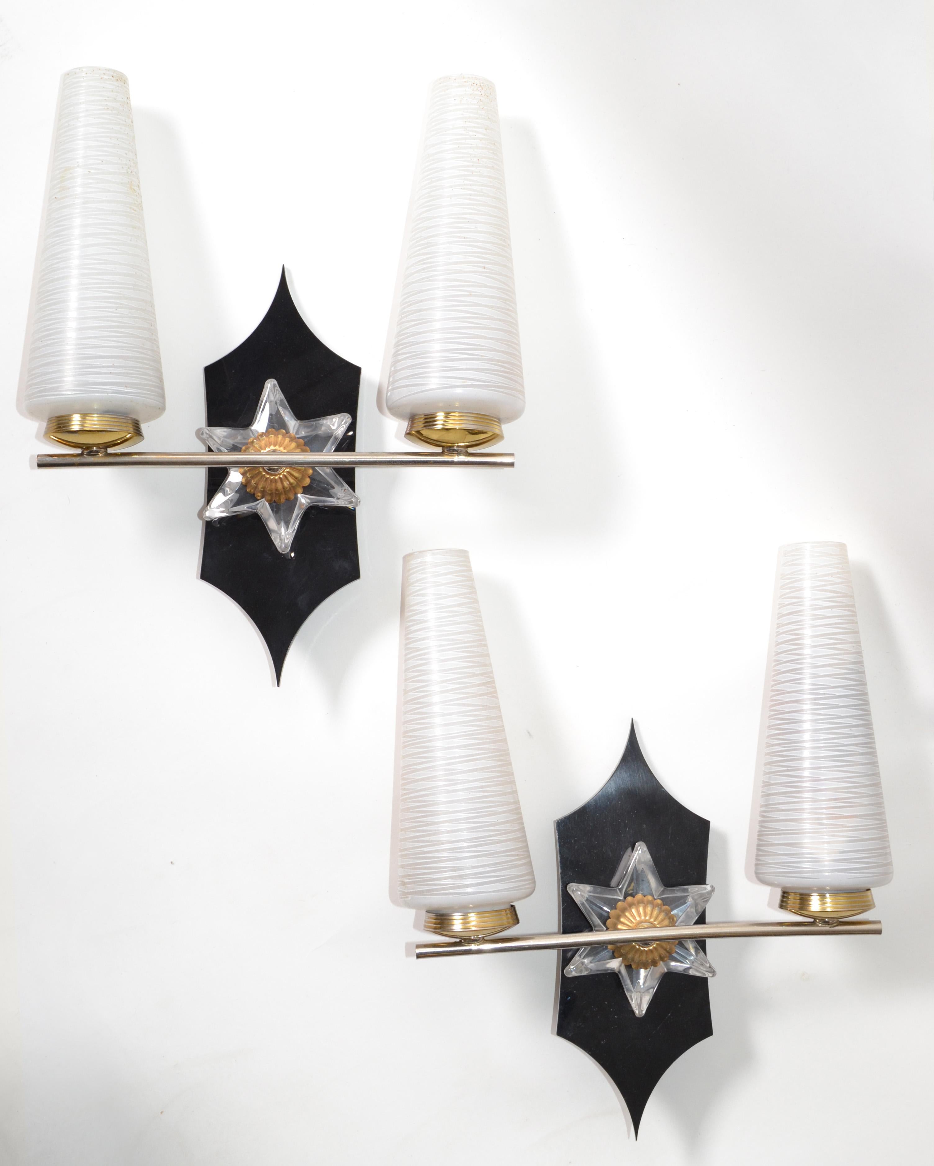 Art Deco pair of sconces, wall lights in Brass, Glass Star and Bakelite with the original blown cone Opaline glass shades.
US rewiring and in working condition, each Sconce takes 2 Light bulbs with max. 40 watts.
Back Plate measures: 2 x 2 inches.