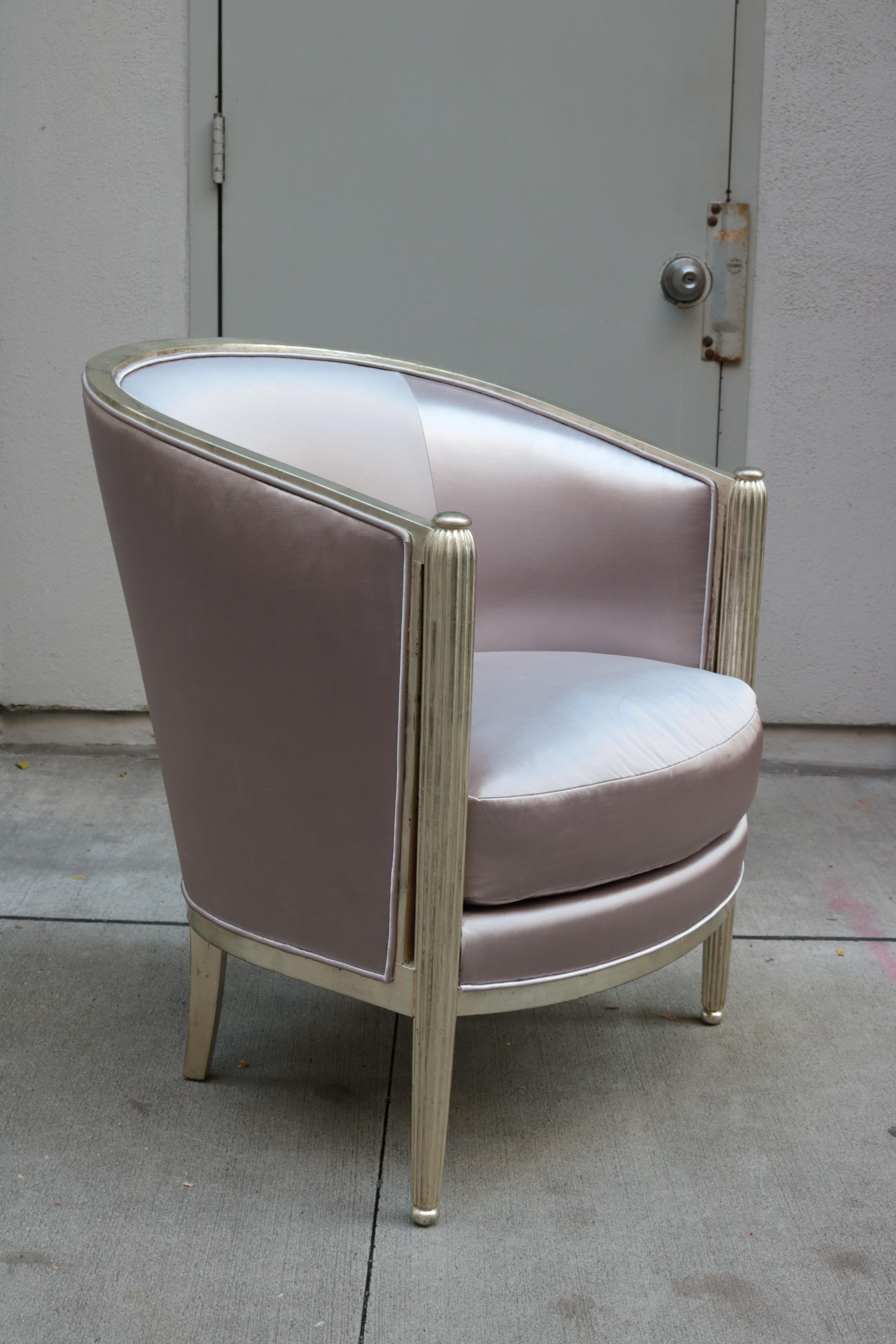 A fine pair of Art Deco white gold armchairs. 
White gold leaf with fluted front leg details.