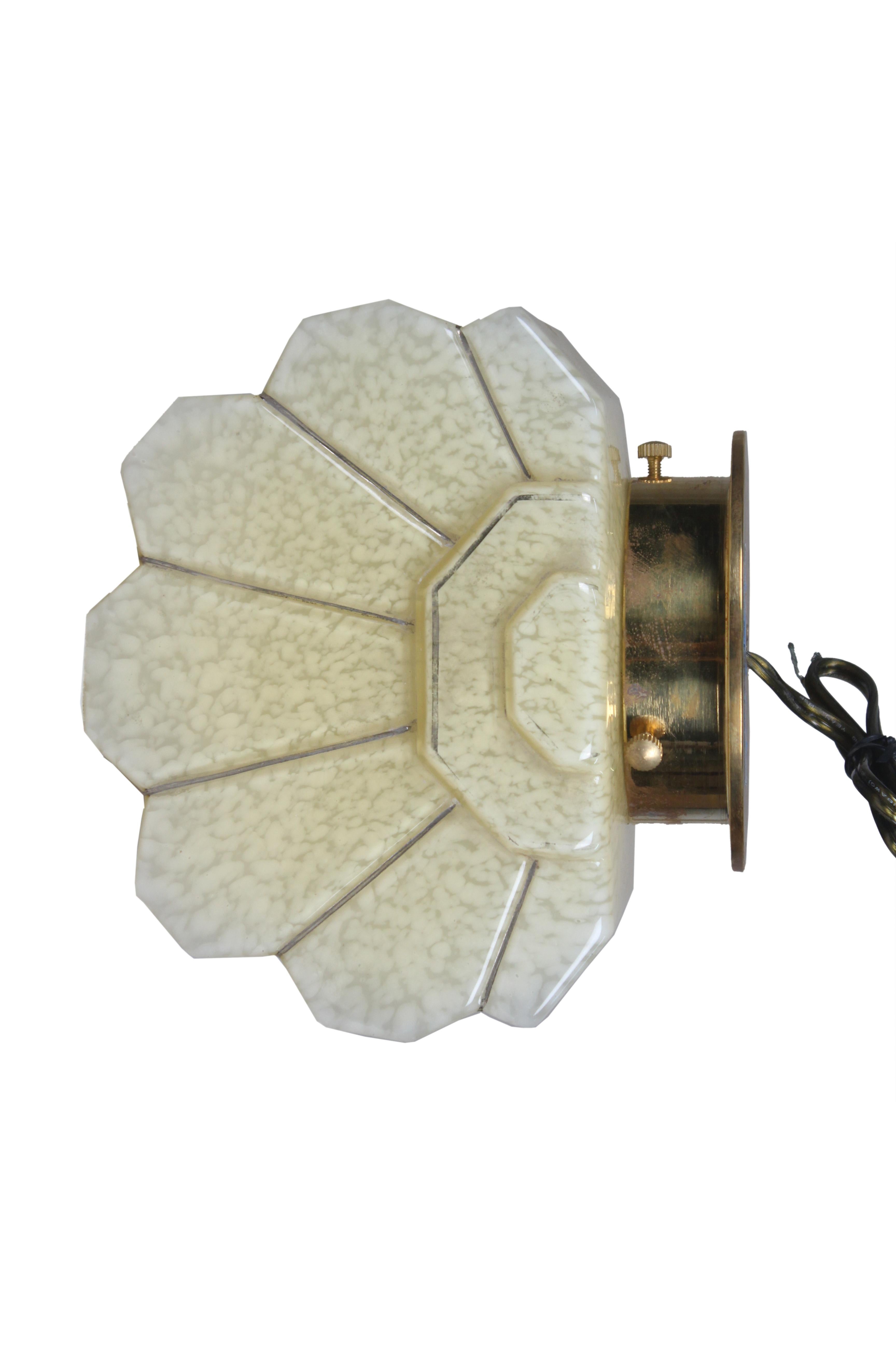 A fabulous pair of Art Deco glass sconce shades mounted on brass back plates. A soft off-white with great dimension. Originally European and rewired for American use. Takes a standard base bulb.