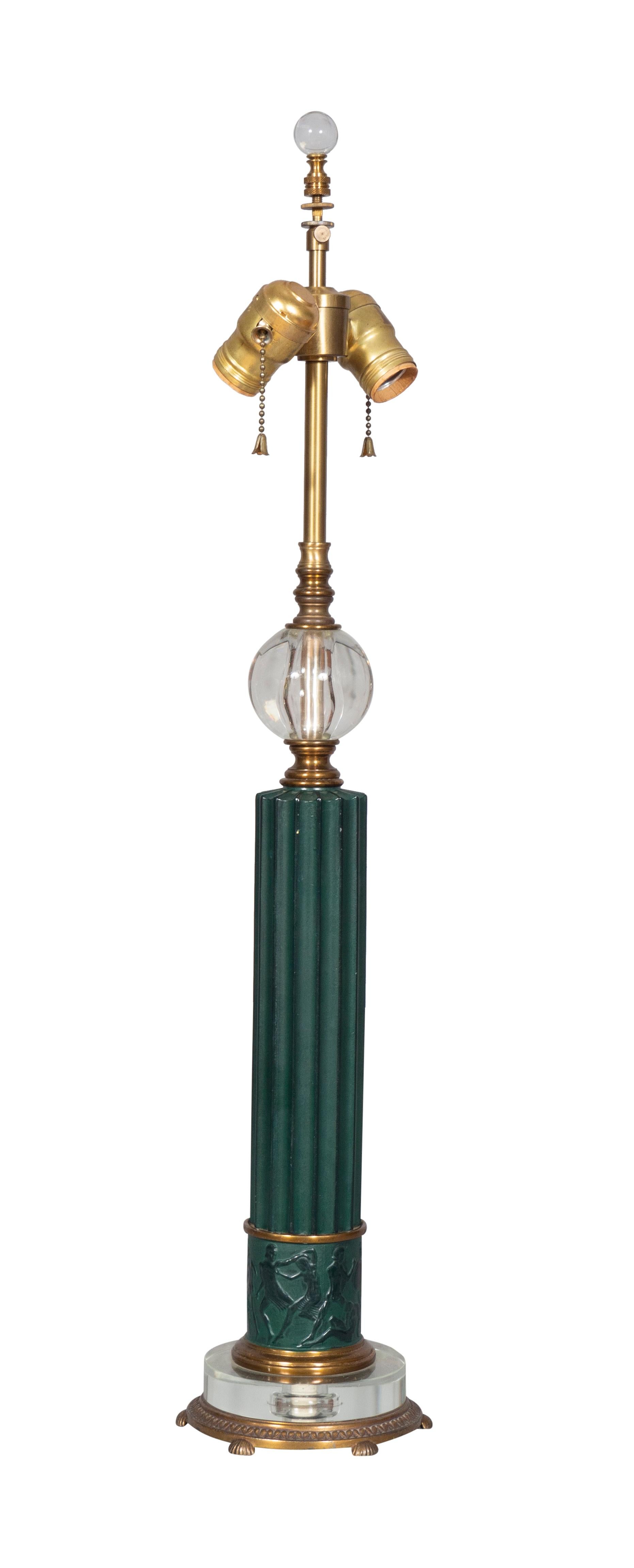 With two light sockets, glass orb over a fluted column ending on a glass disc and footed brass base.