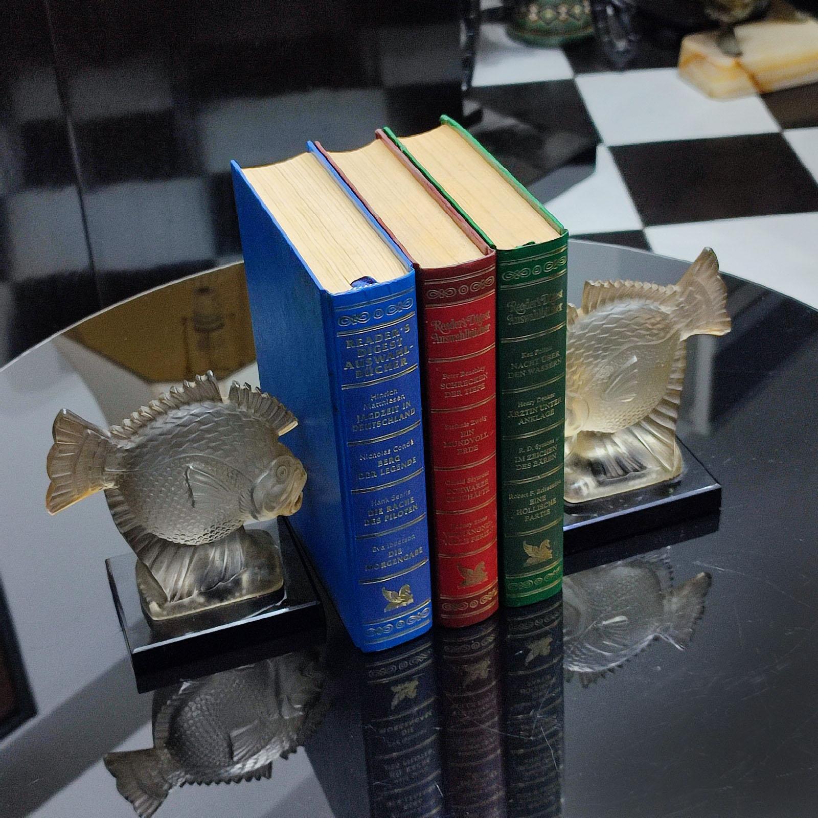 2 early Art Deco Piranha Fish Bookends Pressed Glass, Ferjac France 1930s
French Presglass Fish Bookends, by Fernand Jacob, also known as Ferjac France 1930s.
‘Poisson’. Grey, transparent, frosted pressed glass. 
Each with a sculpted fish; signed