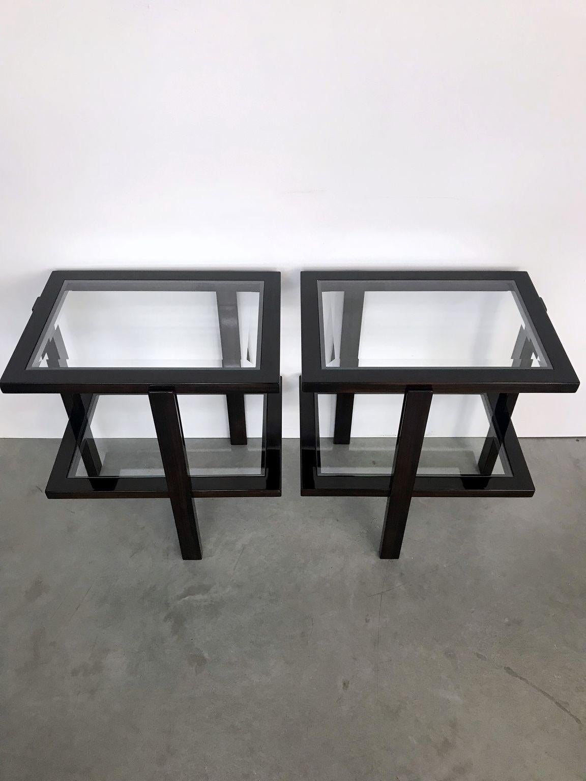A pair of Art Deco side tables with glass. Colorized walnut wood with new polished glasses.