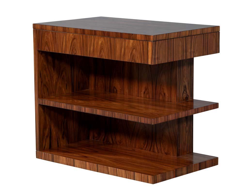 Art Deco inspired nightstand end tables. These stunning pieces feature a clean linear design that makes for a timeless style. The stands are finished in a light walnut stain and satin finish coat. Sold only as a set.