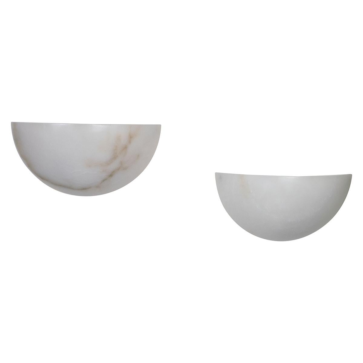 Pair of Art Deco inspired Spanish alabaster sconces. Each piece displays naturally occurring variations in color and veining.