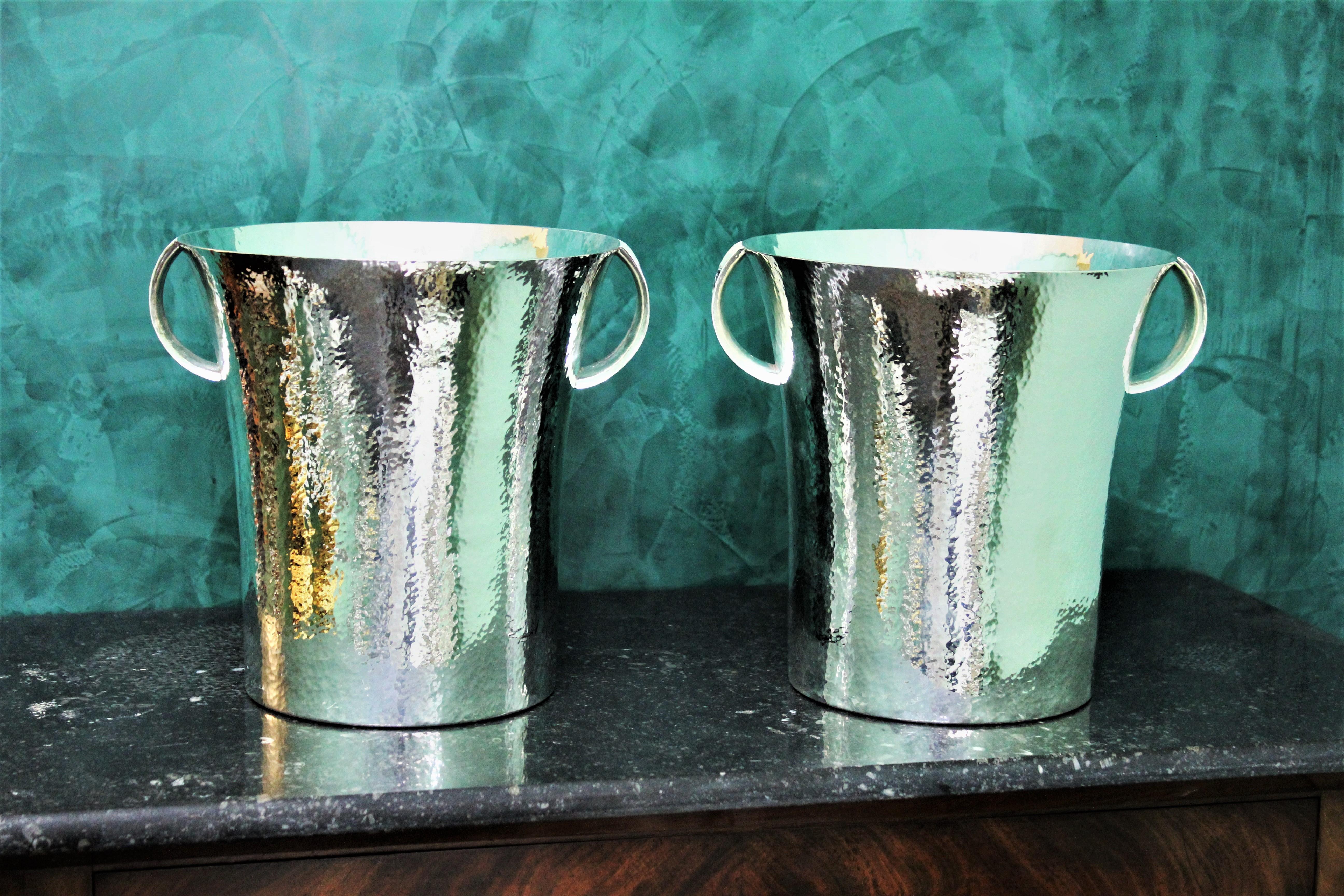 Pair of art decò silver wine coolers realized on commission between 1934 and 1944 in Italy by the silversmith Paolo Scavia for a local family. 
Silver 800/1000 mark and manufacturer mark and fasciscm period mark (1934-1944)
Handcrafted and