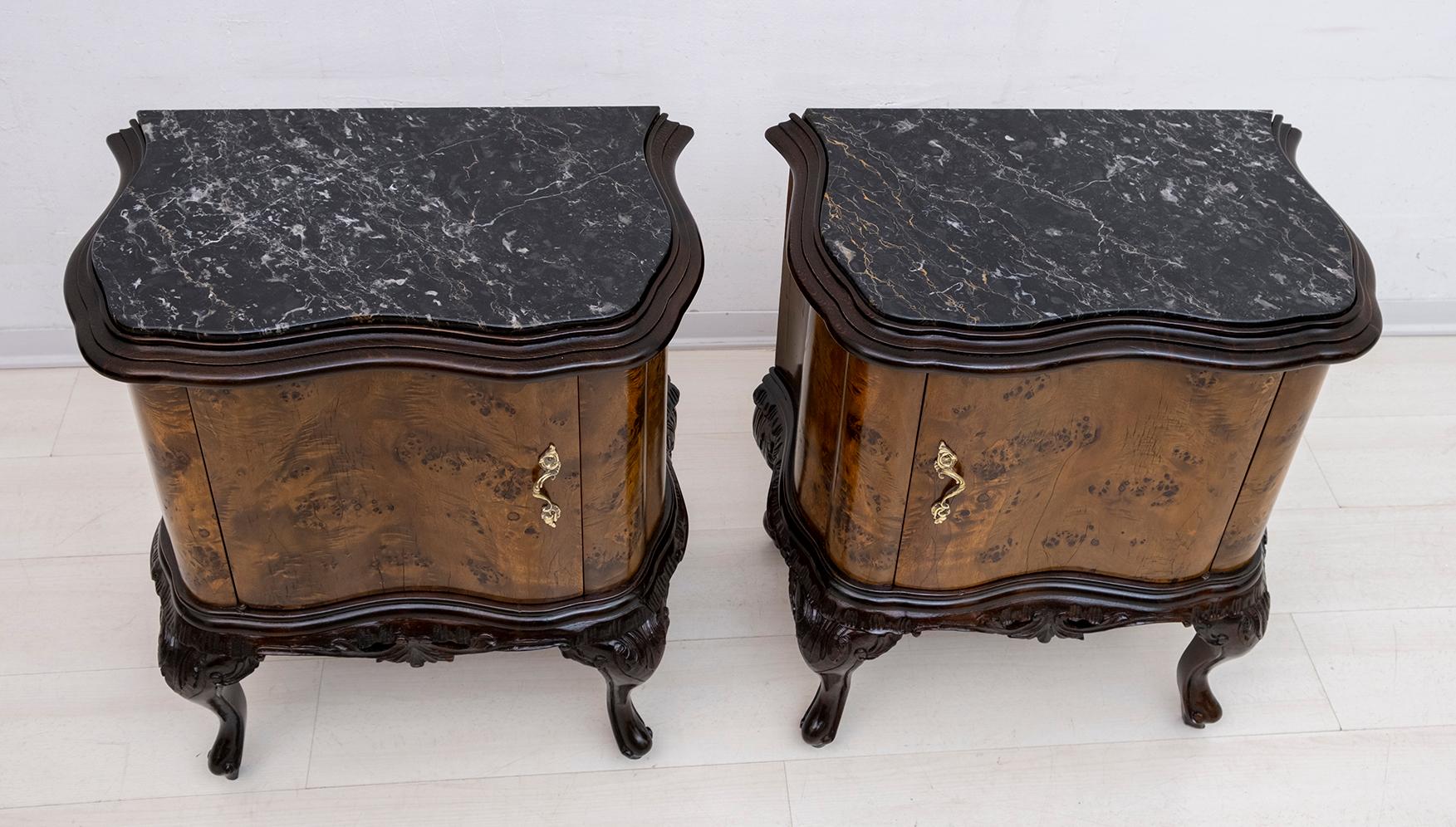 This pair of bedside tables was produced in Italy in the 1920s, Art Deco period. They are covered in briar walnut, feet and frames in beech wood stained dark walnut, the top is in black Marquinia marble, the structure is in poplar and the handles