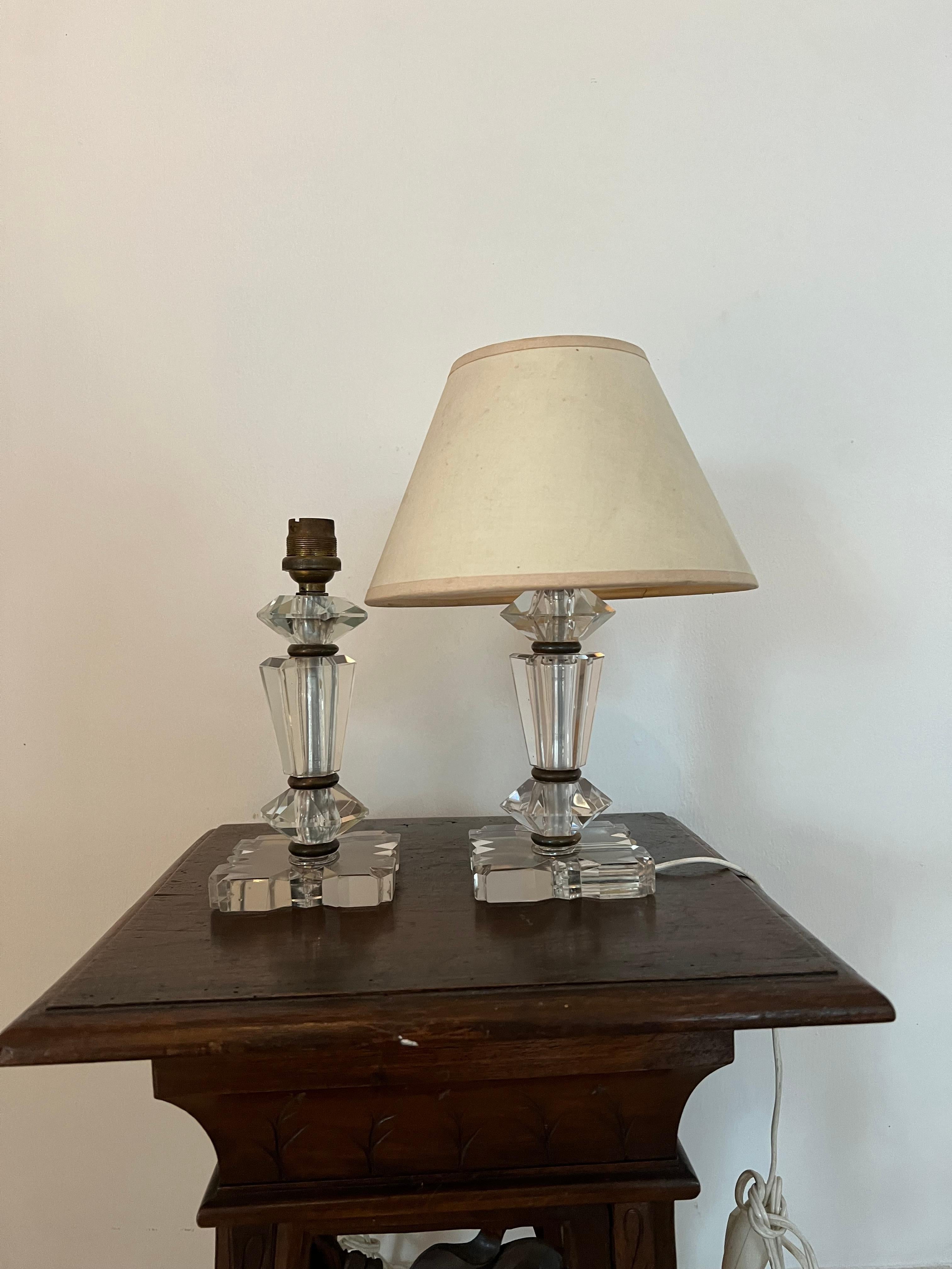Beautiful pair of table lamps in the style of Baccarat and Jacques Adnet but they are not marked.
Manufactured in hand cut lead glass.
France circa 1940.
The pieces 