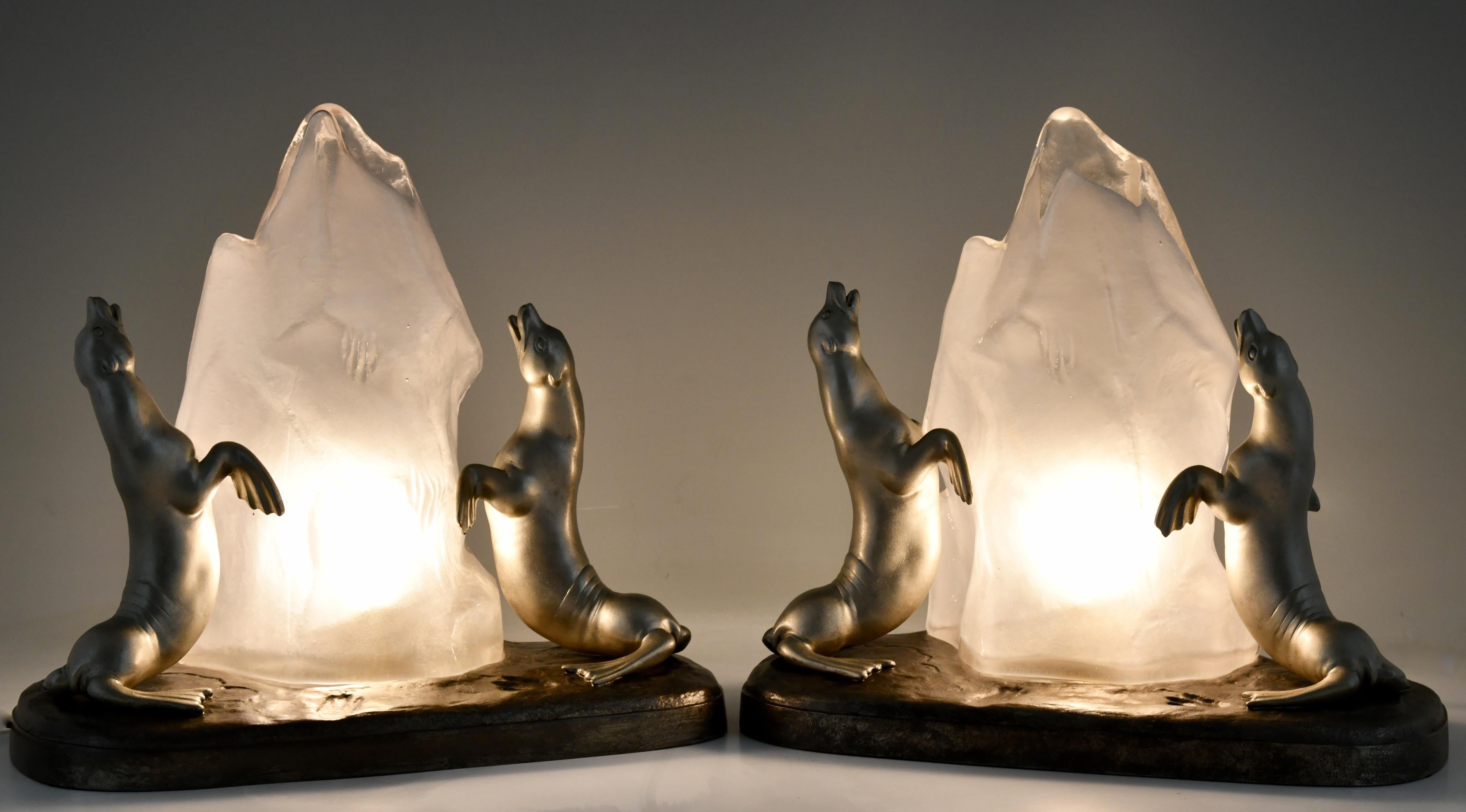 Pair of Art Deco lamps with seals. The glass lamp shade is modelled as a block of ice by Louis Albert Carvin With foundry seal. France 1930.